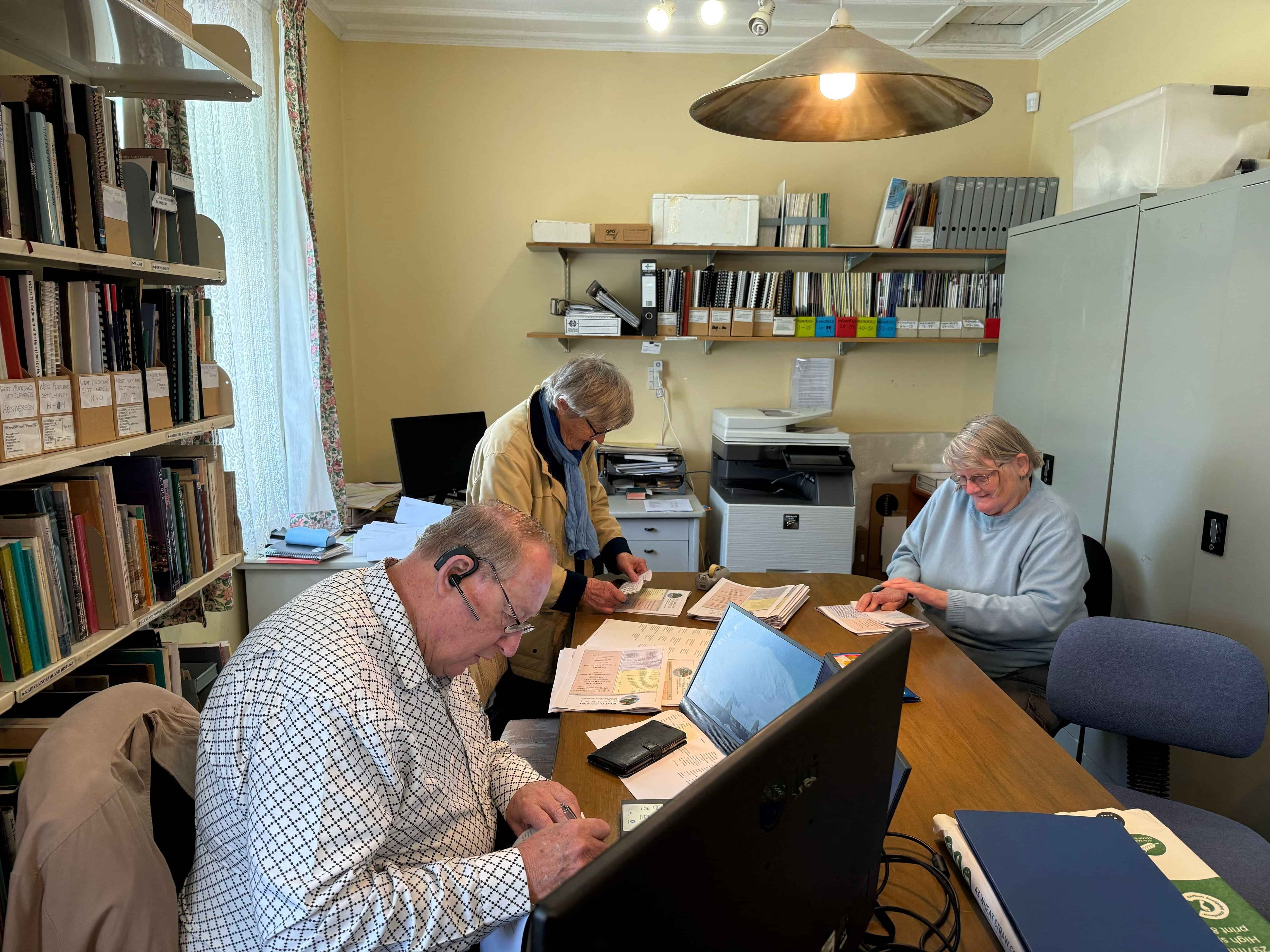 A group of adults working together at a table