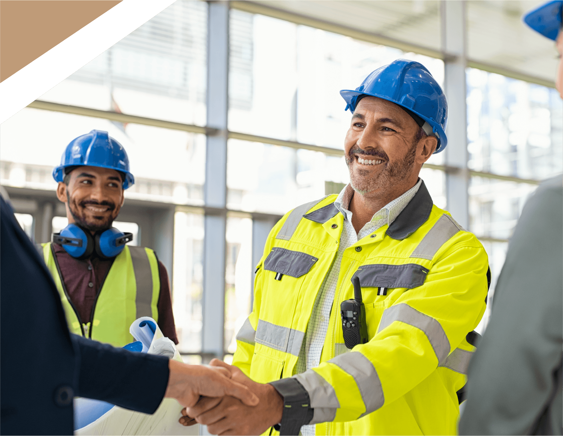 A happy builder shaking hands with a client