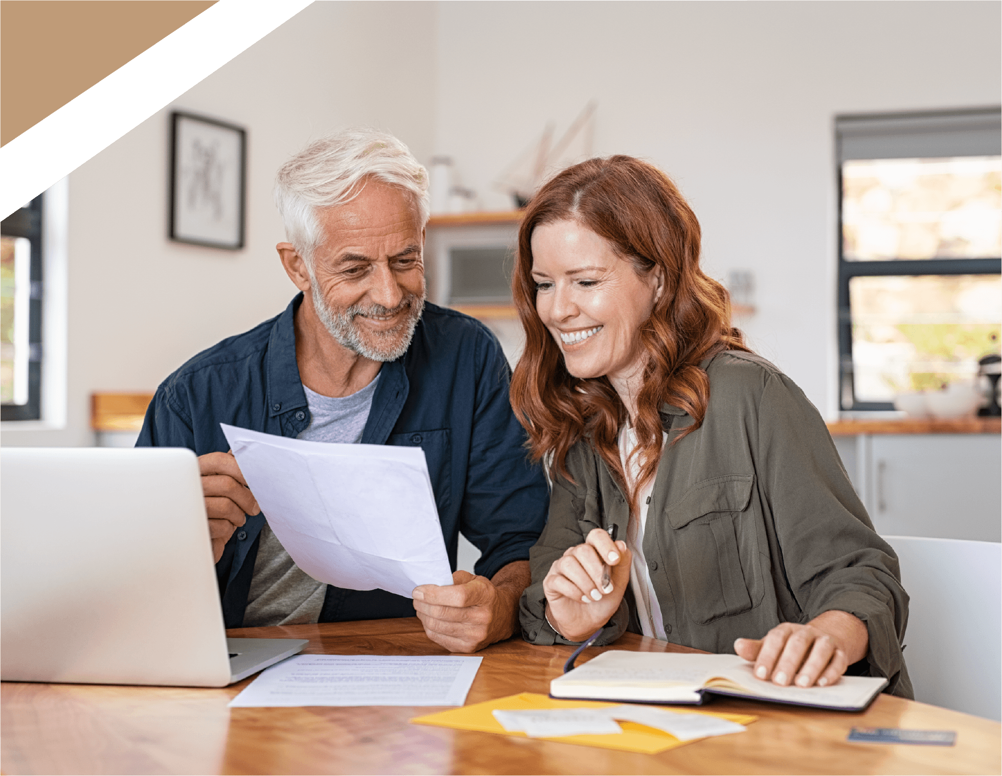 Happy couple looking through paperwork