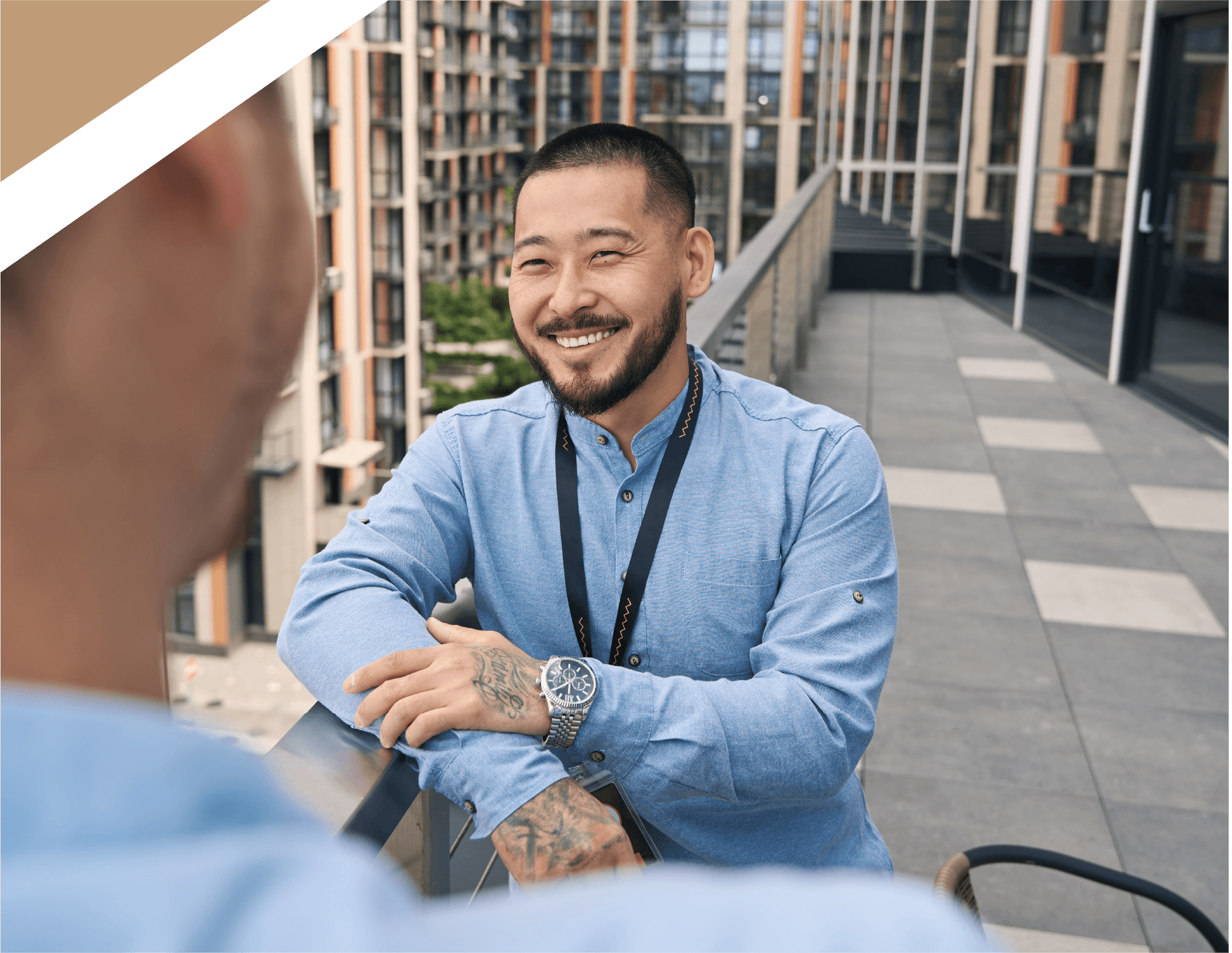 Happy businessman talking to his colleague