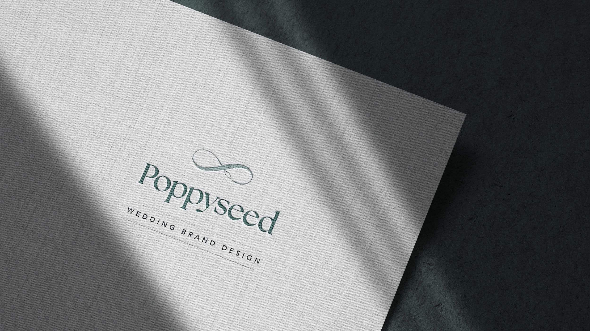 Poppyseed Design logo on textured paper | Wedding Branding Studio New Zealand