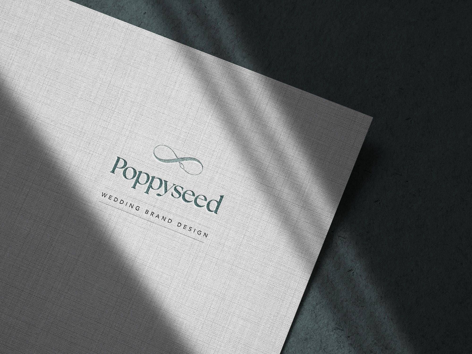 Poppyseed Design logo on textured paper | Wedding Branding Studio New Zealand