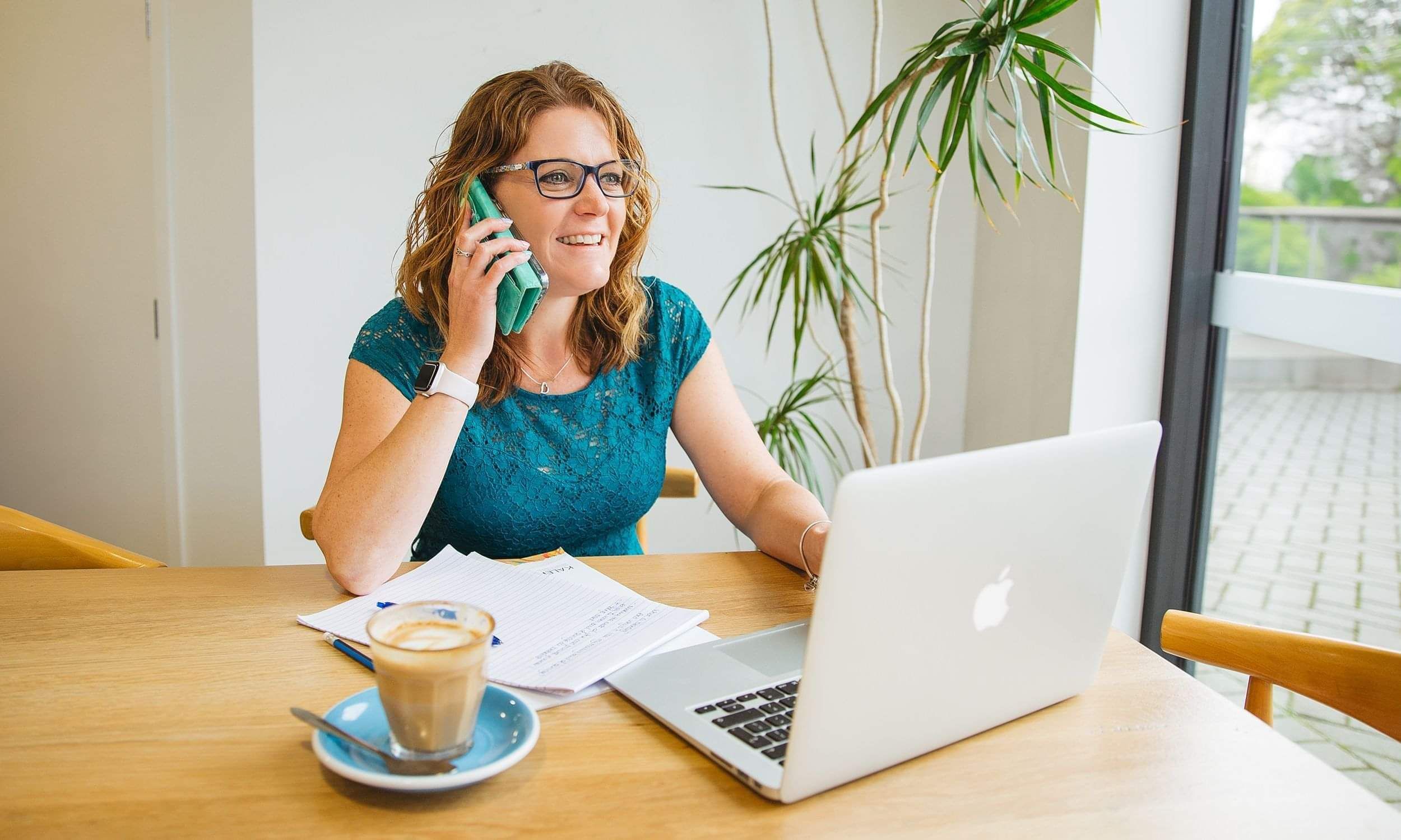 Amy from Poppyseed Design, a wedding stationery designer,  speaking with a client in her Tauranga studio
