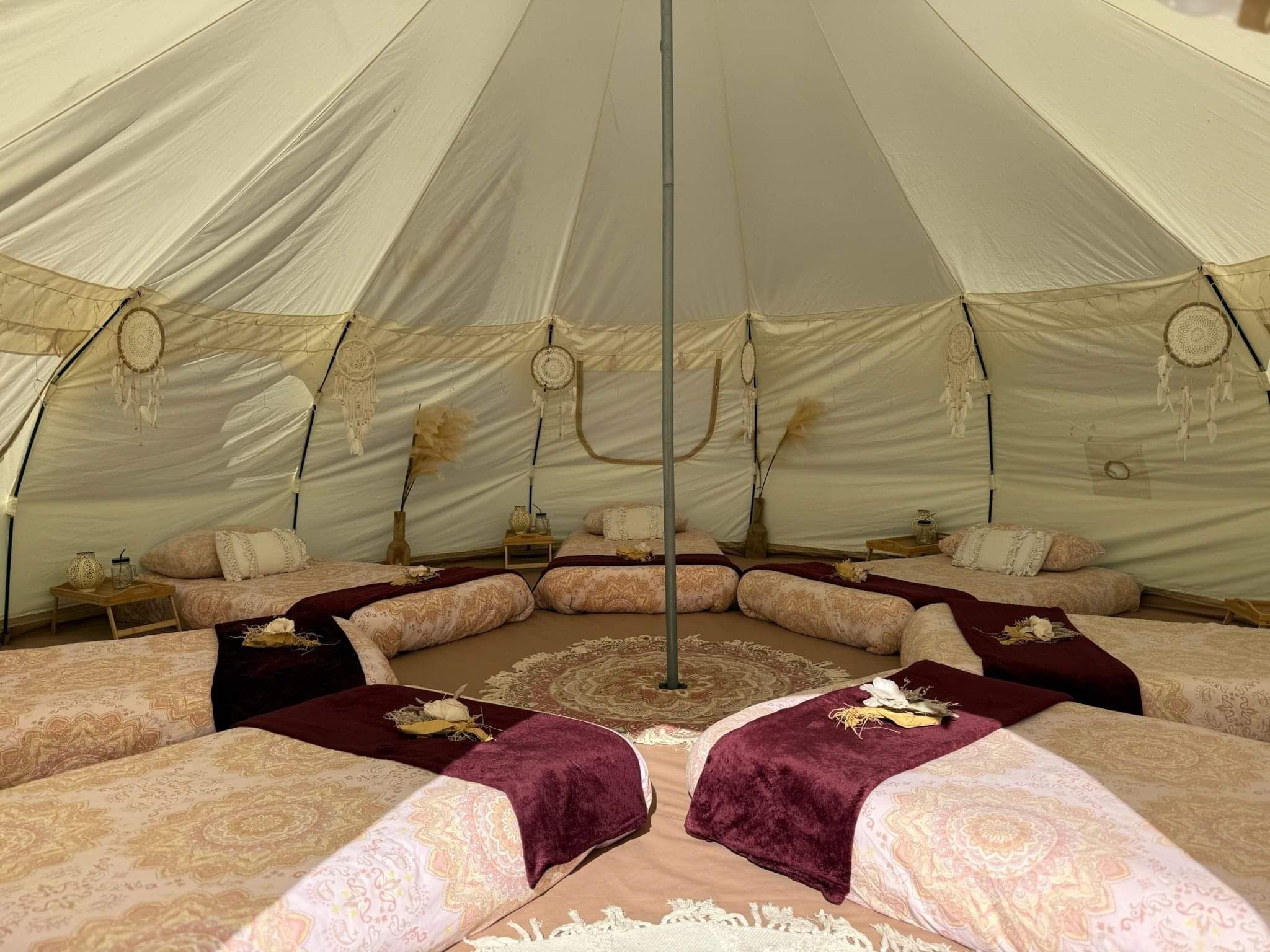 “Luxury Boho glamping sleepover setup inside a bell tent by Sleeping Beauties Southland.”