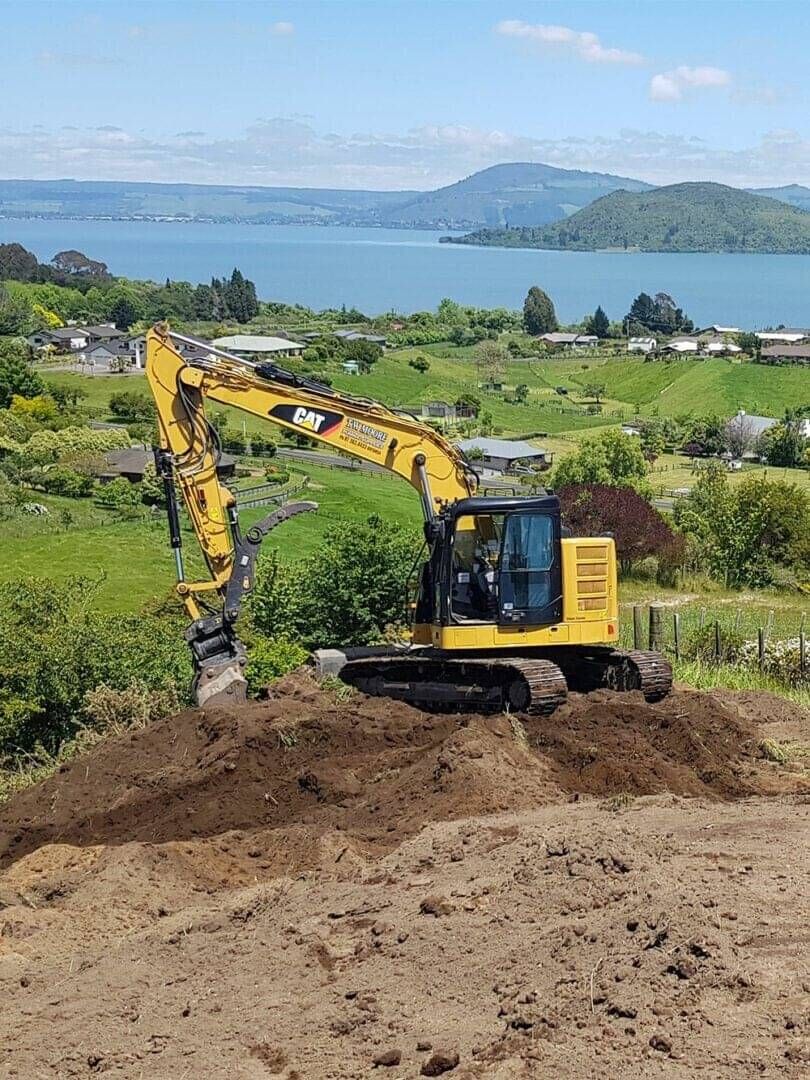 Landscape reshaping and earthworks on a sloped Rotorua property with a view of Lake Rotorua