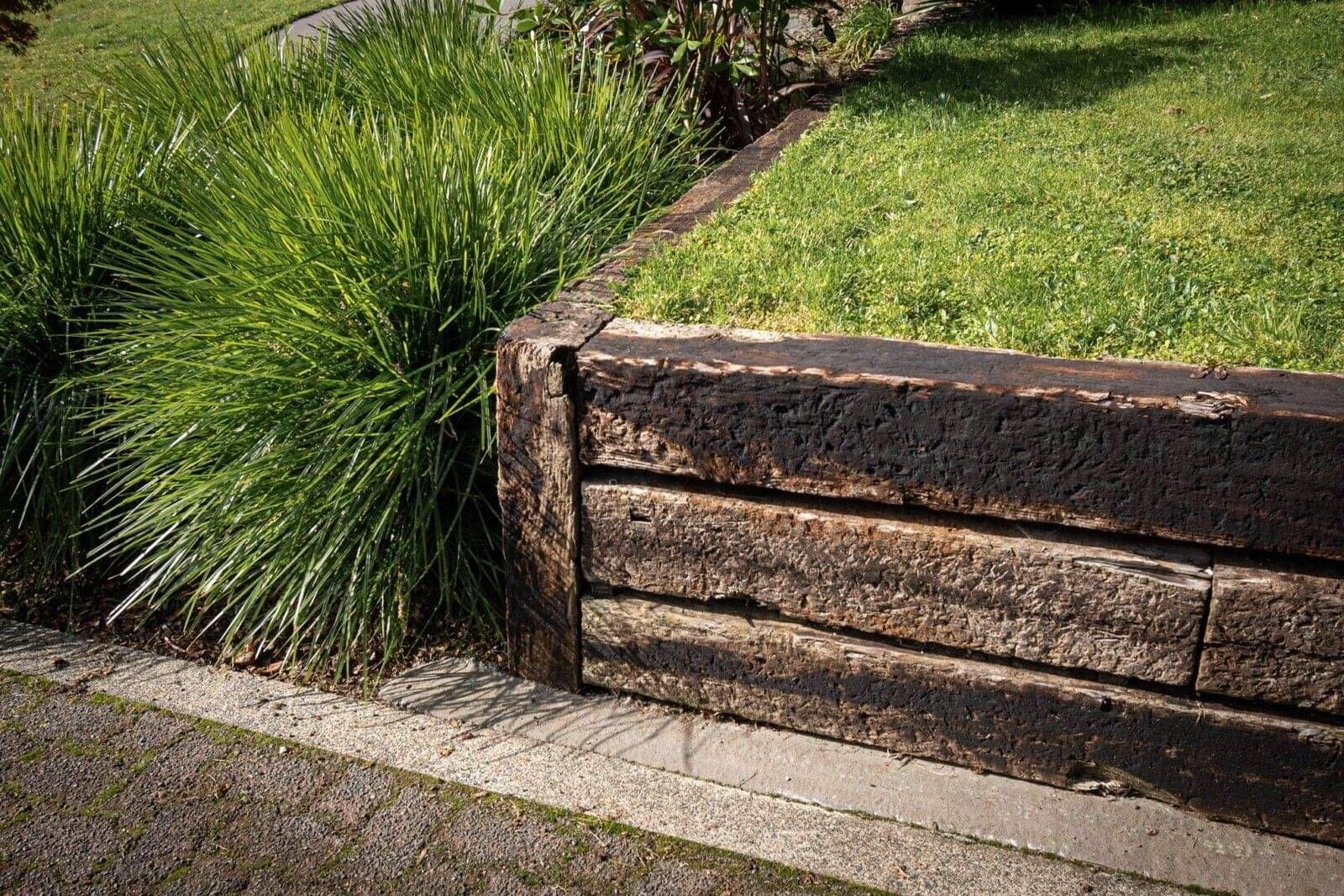 Railway sleepers for retaining walls in a landscaped property in Rotorua