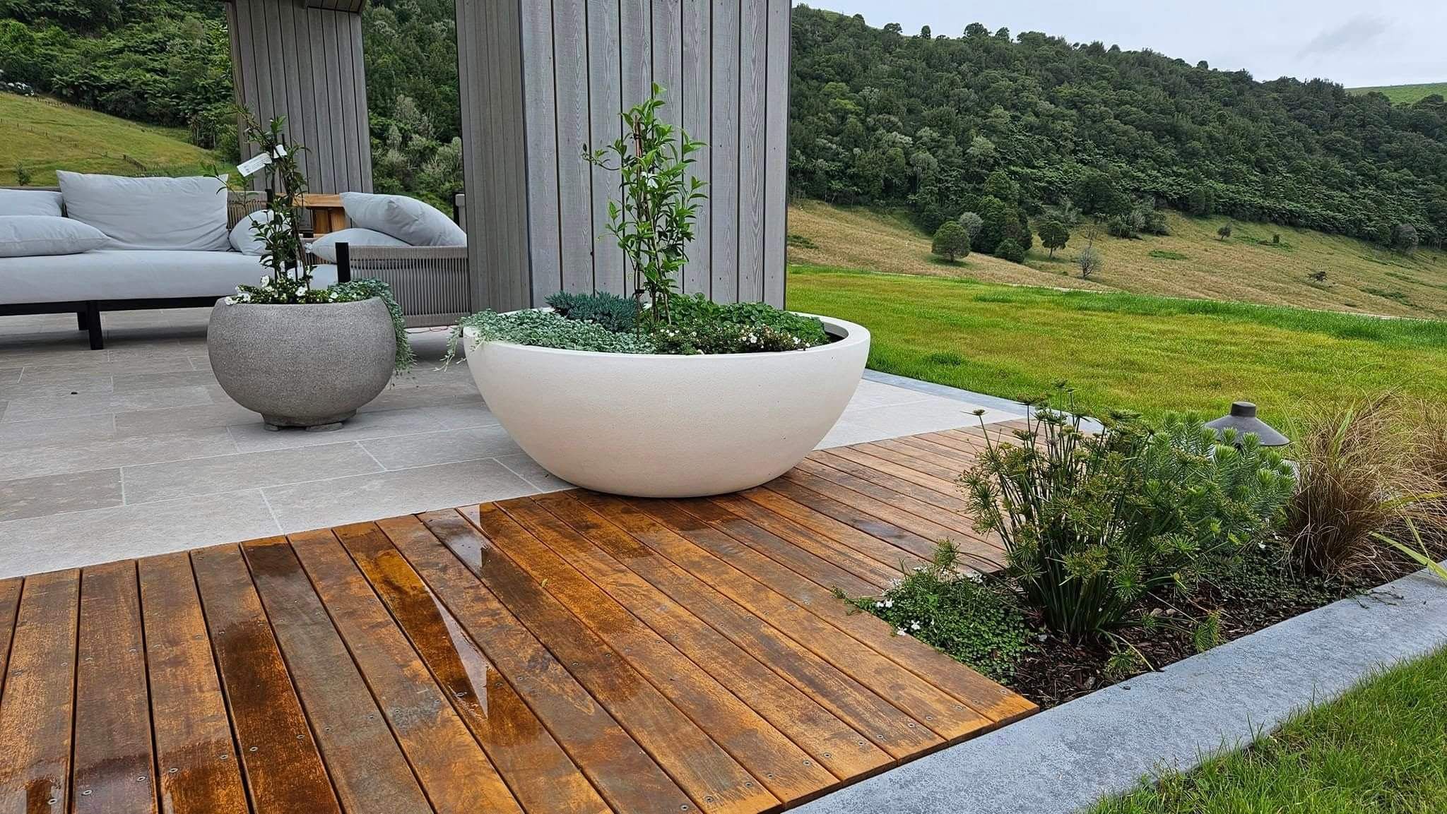 Deck seamlessly integrated into garden landscaping by Ultrascape