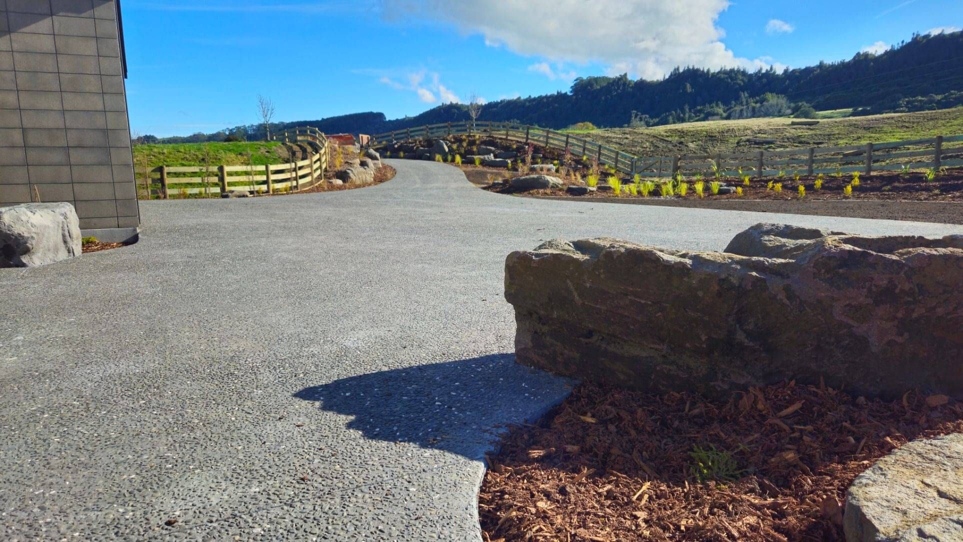 Landscape outdoor living design in Rotorua with pool and deck area for sunning