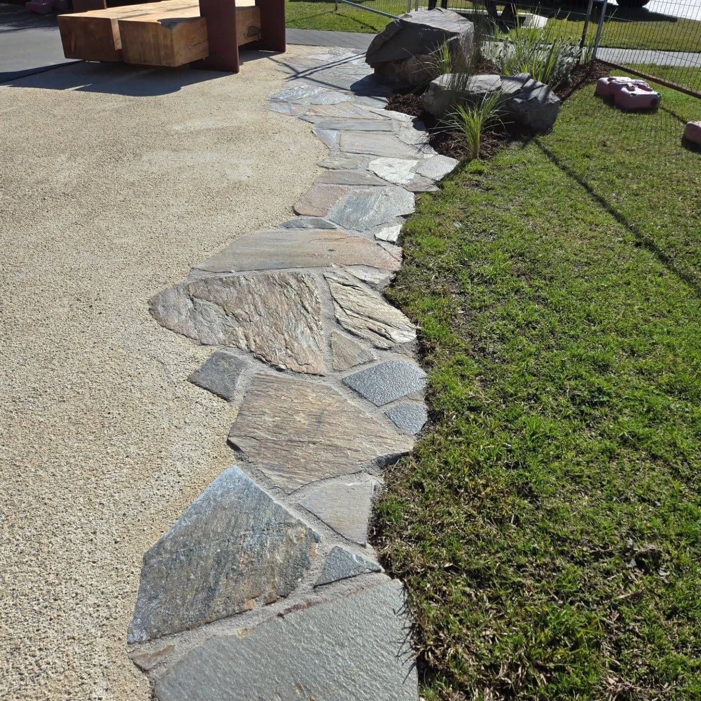 Landscape outdoor living design in Rotorua with pool and deck area for sunning