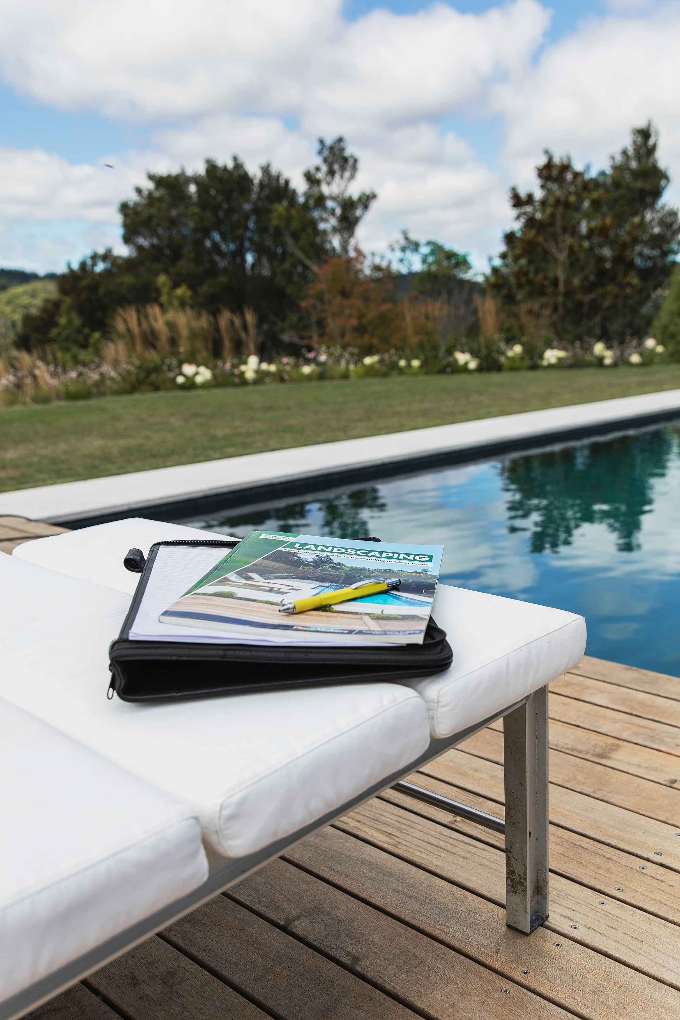 Landscaped outdoor living area in Rotorua with timber decking and pool