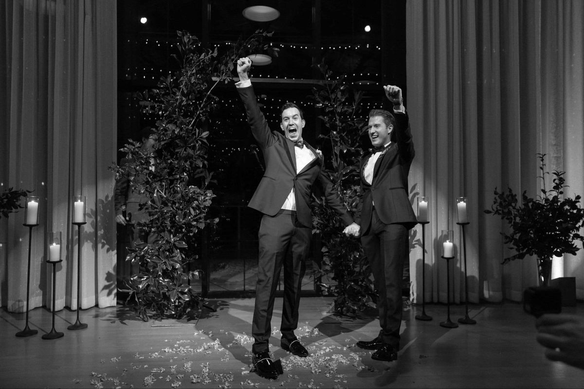 Newlyweds celebrating together at their wedding reception