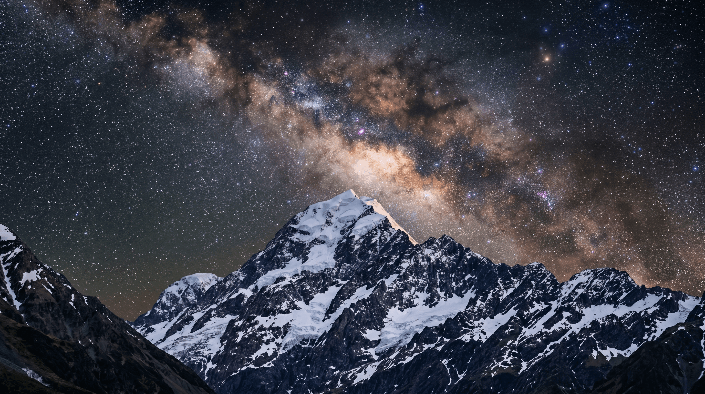 Dark sky and snow capped mountains