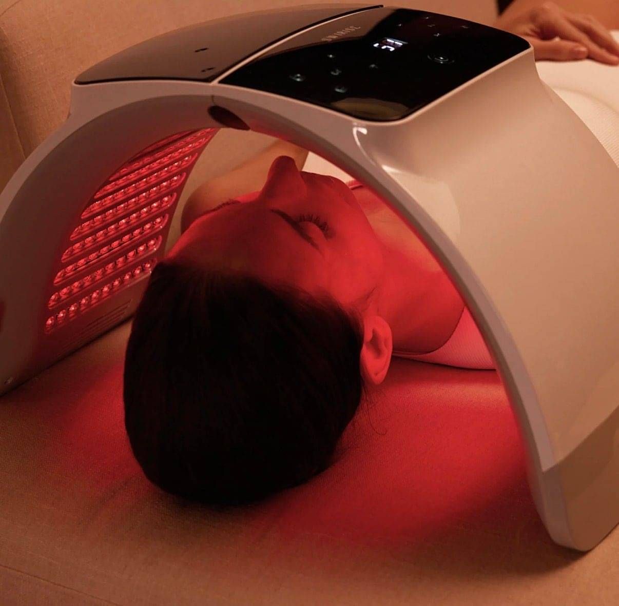 Lady lying face down having a shoulder and arm massaged