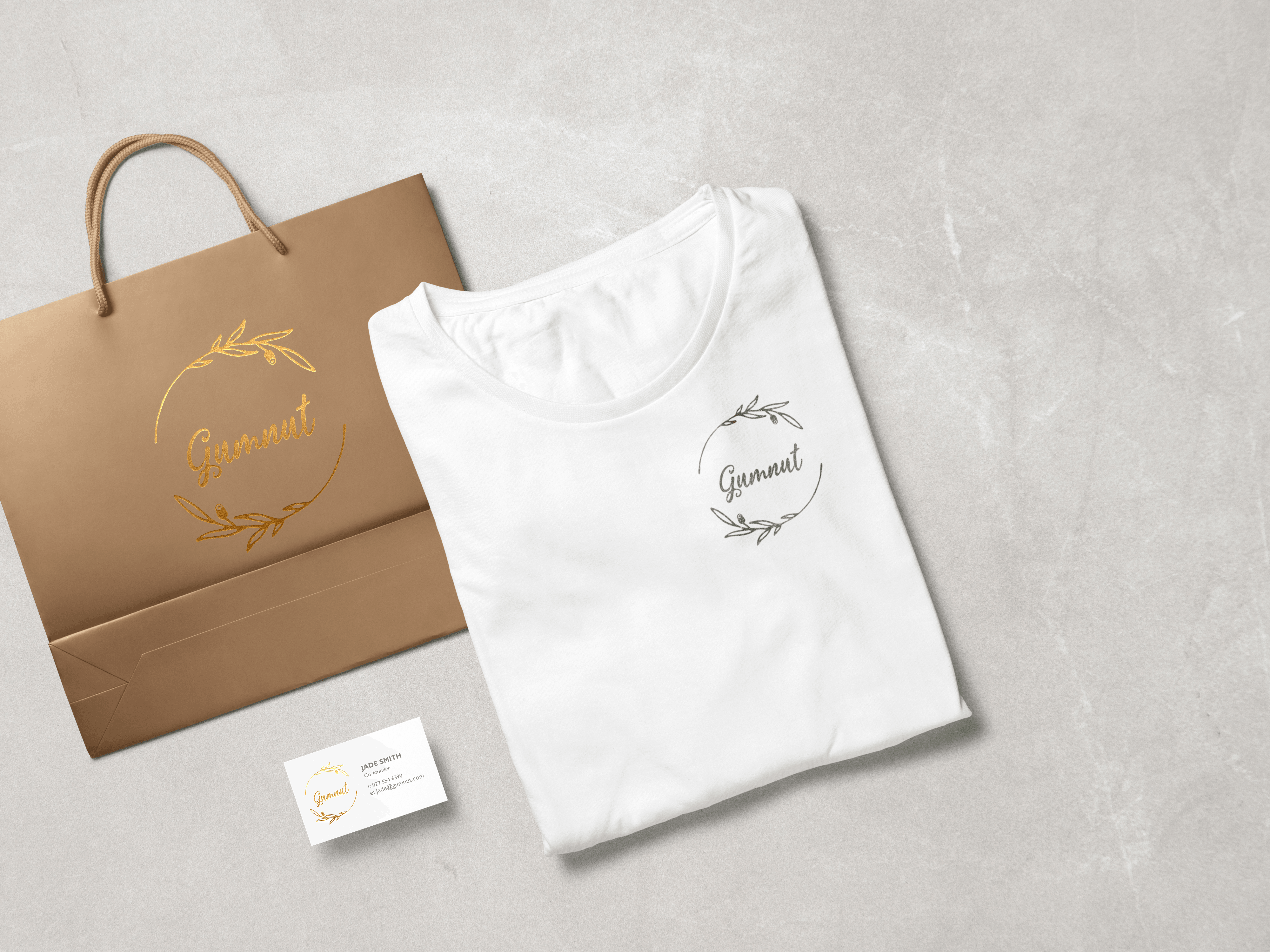 Flatlay of shopping bag, t-shirt and business card for Gumnut