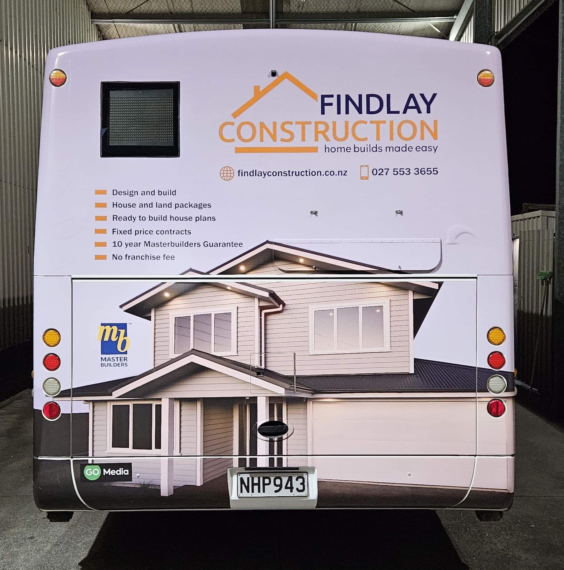 Findlay Construction advertising on the back of a bus