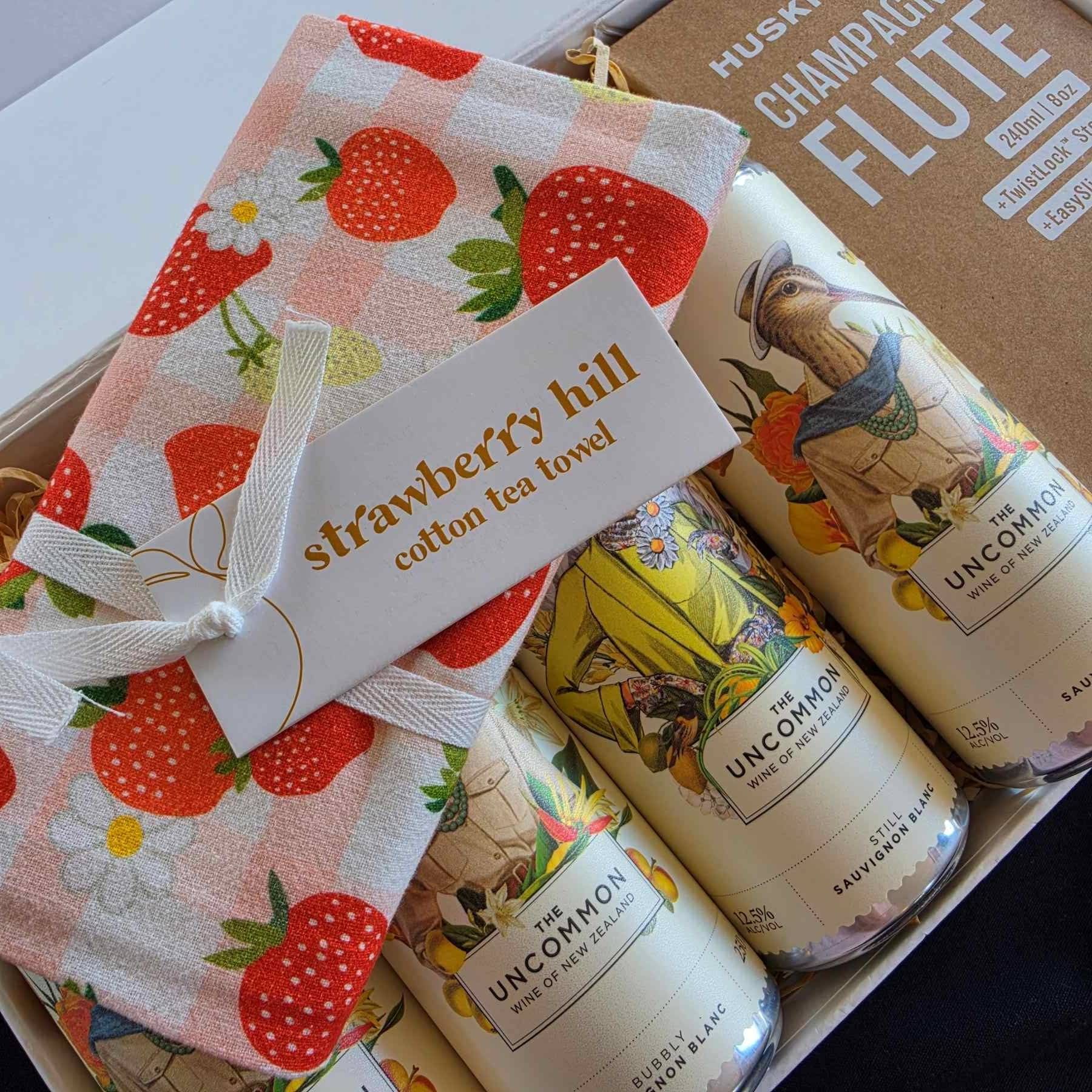 lets celebrate gift box with the uncommon wines, huski flute and strawberry hill tea towel all nz made
