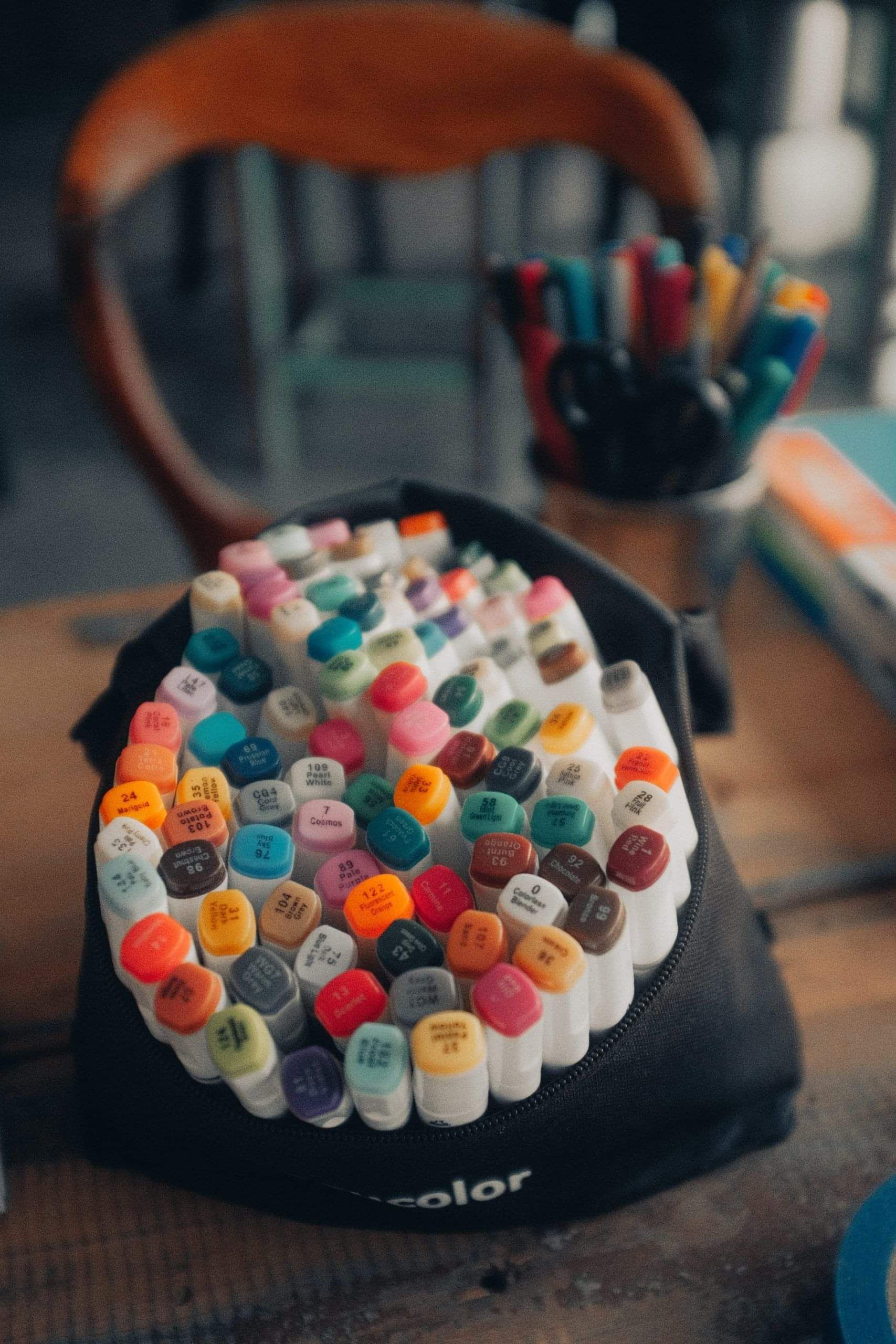 A bag of assorted coloured marker pens.