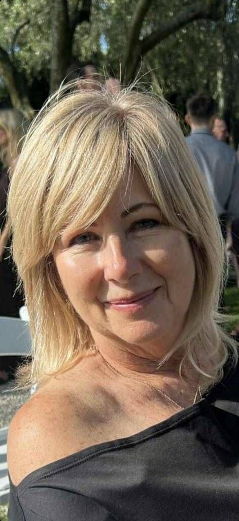 Photo of Marina Hanger, occupational therapist and travel guide, smiling warmly.