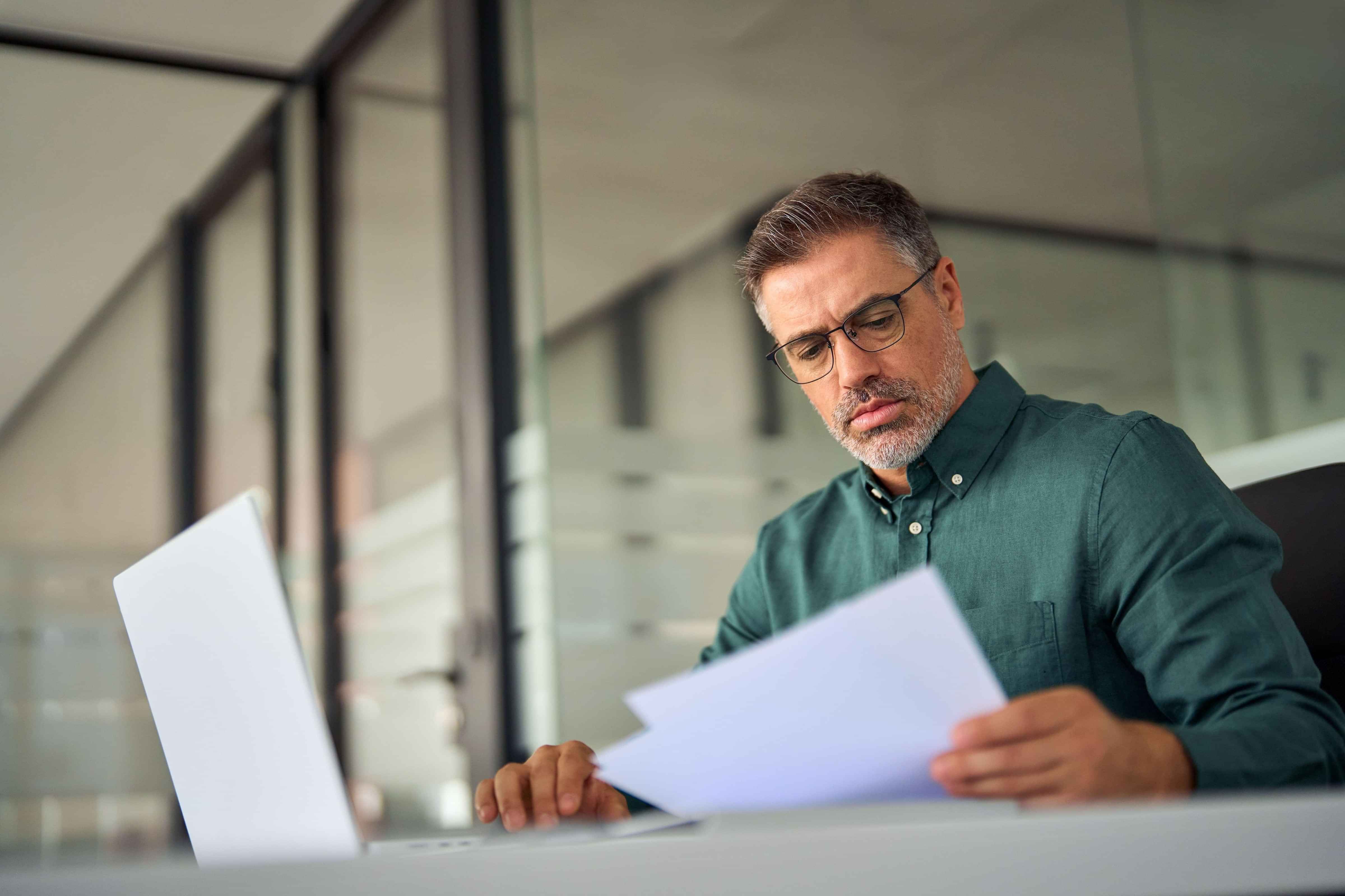 Business man reading papers