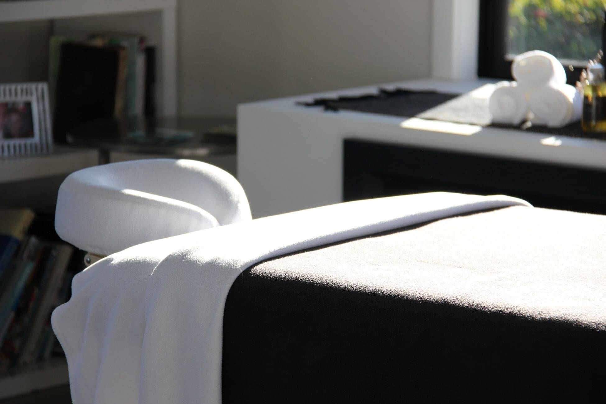 A sun soaked massage bed ready and set up for a client.