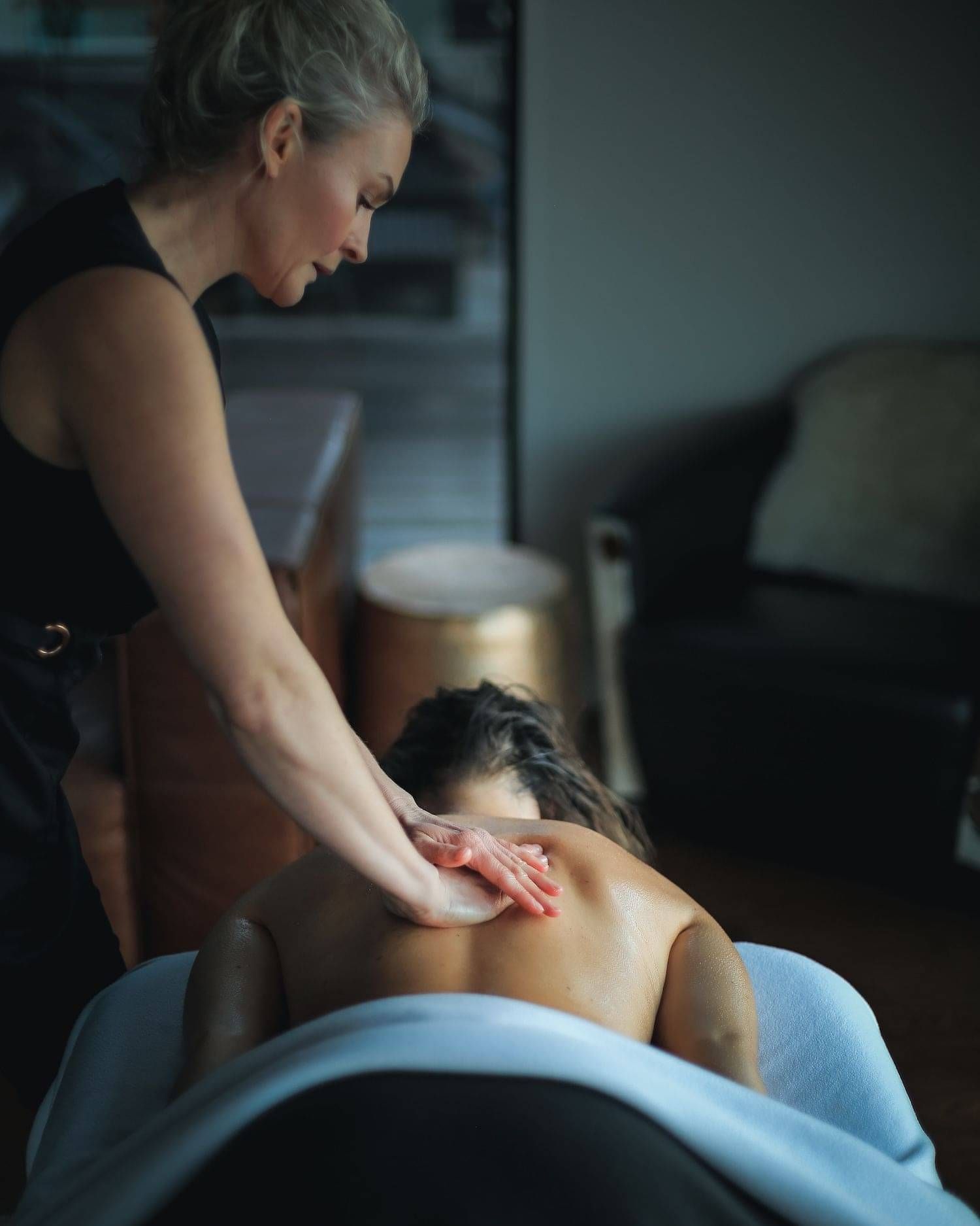 A clients back being expertly massaged by one of the Indulge team.
