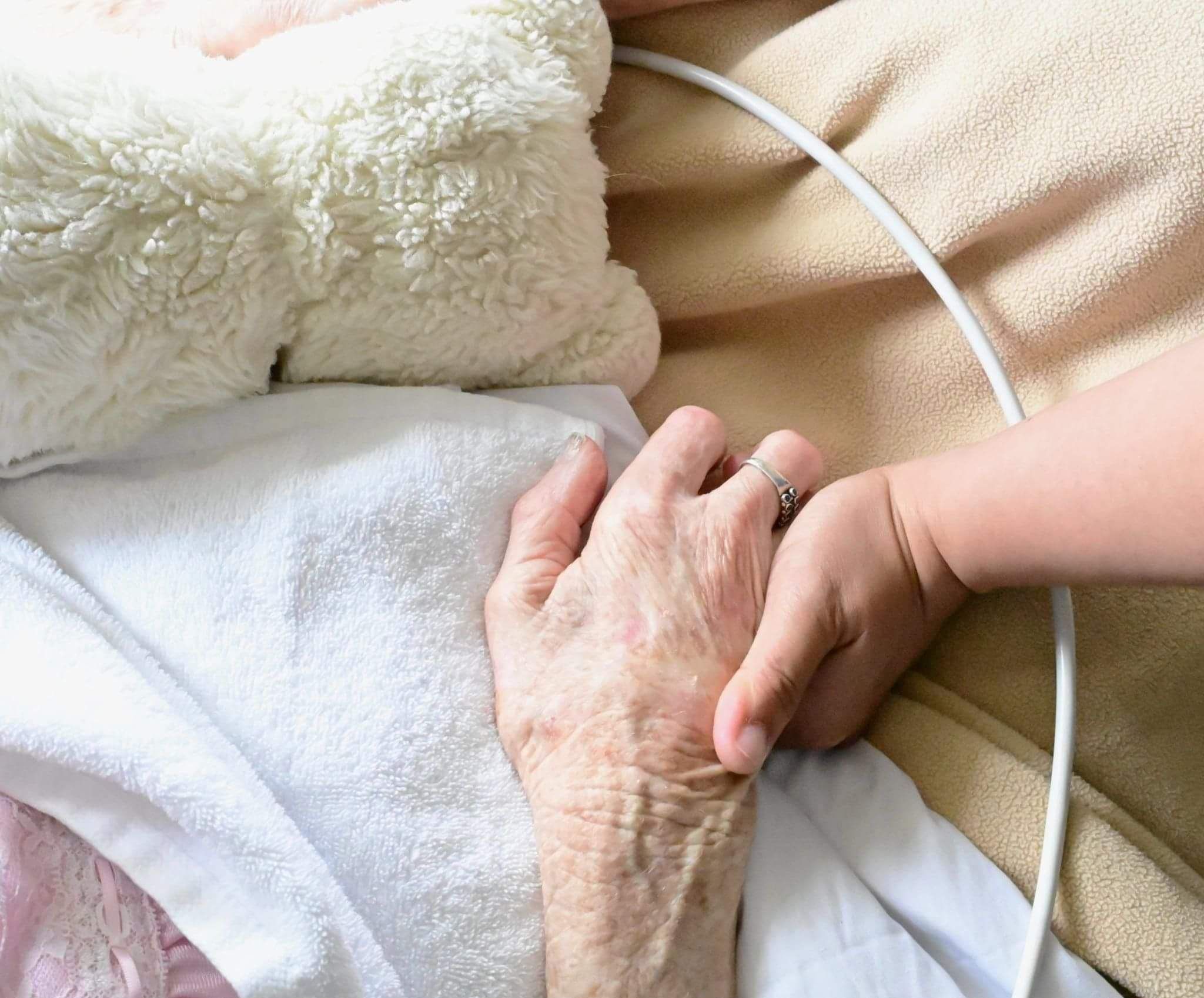 Beattie Home Aged Care Photo of elderly hand with childs hand