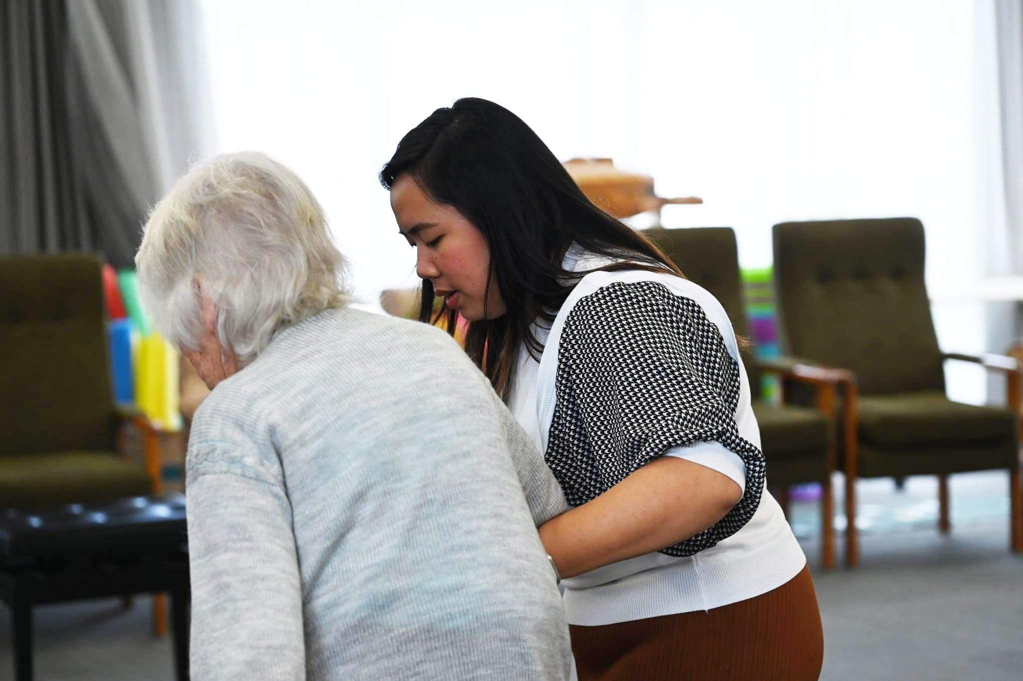 Registered nurse caring for elderly woman