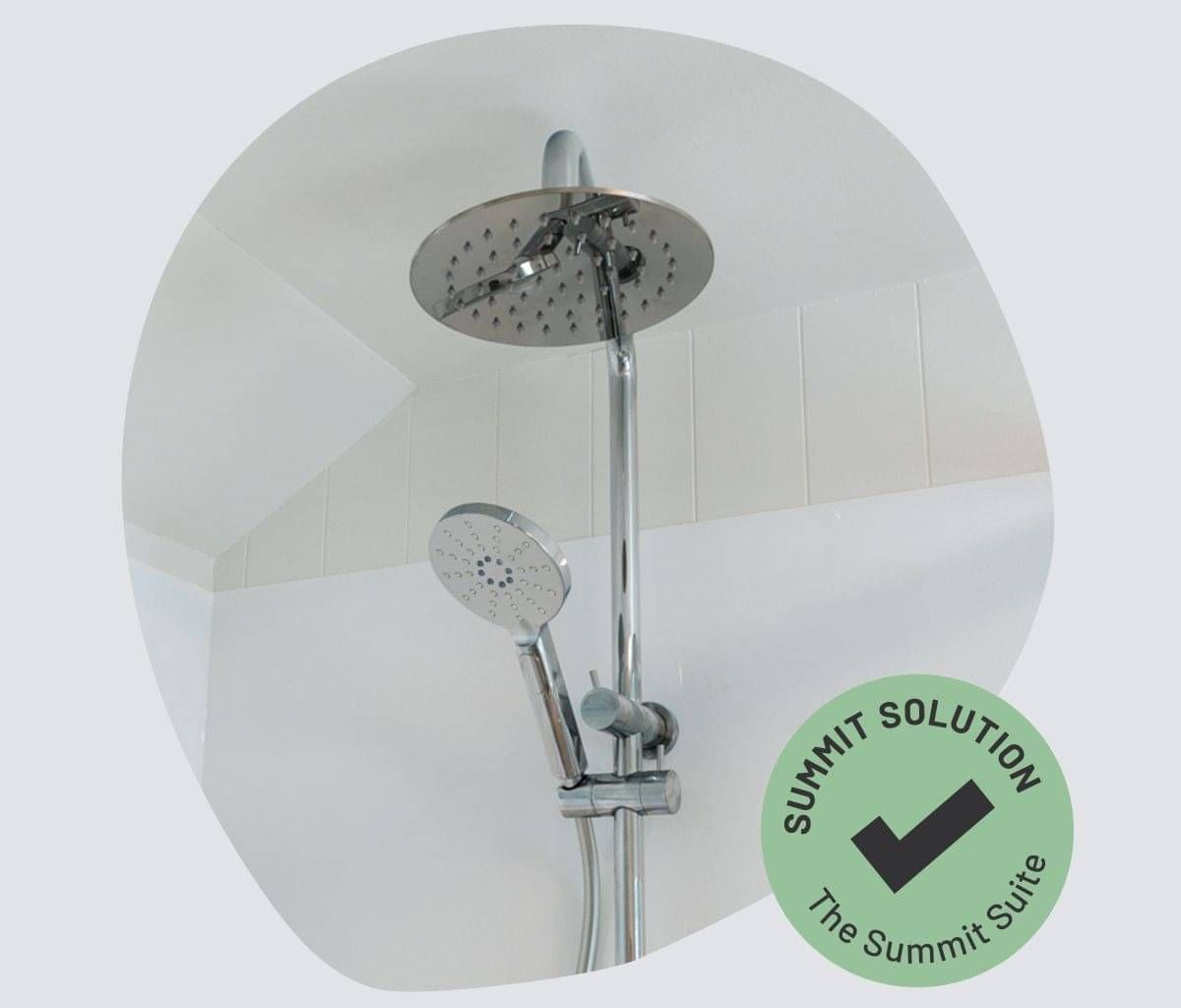 Double shower head fitted in a portable bathroom.