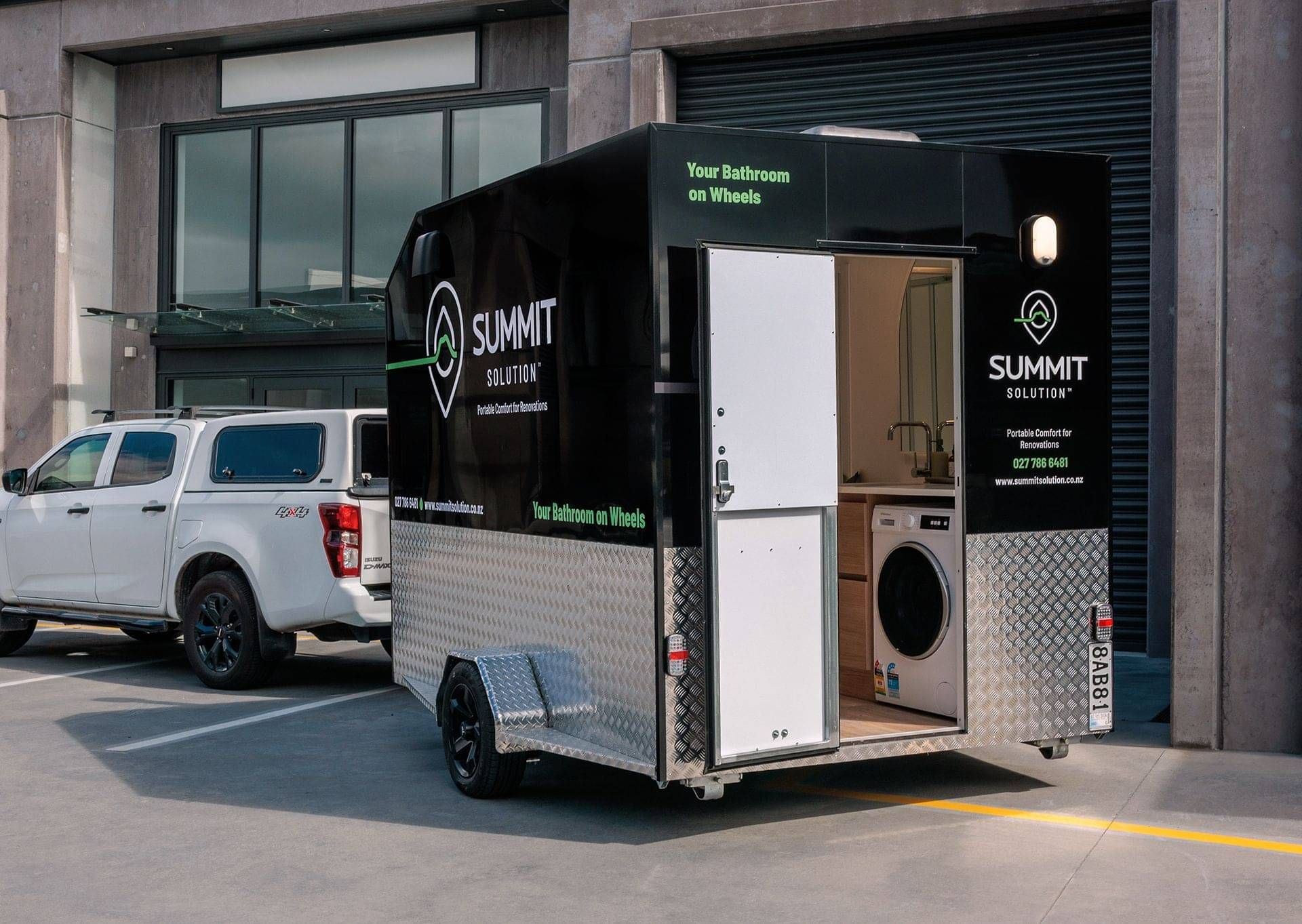 A Portable bathroom trailer unit attached to a Ute.