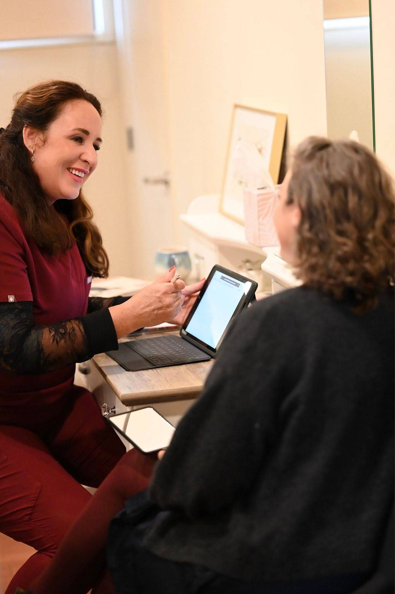 Photo of Kylie Dillon offering a cosmetic treatment consultation