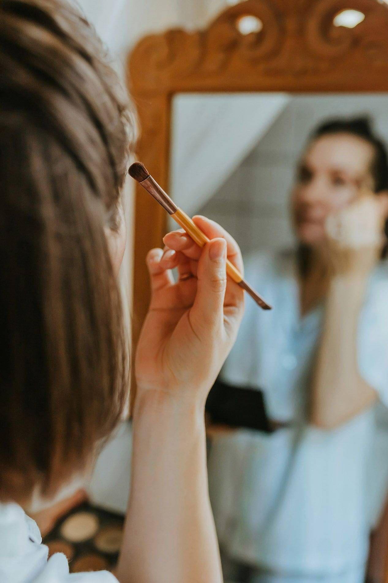 Photo of a woman applying make-up