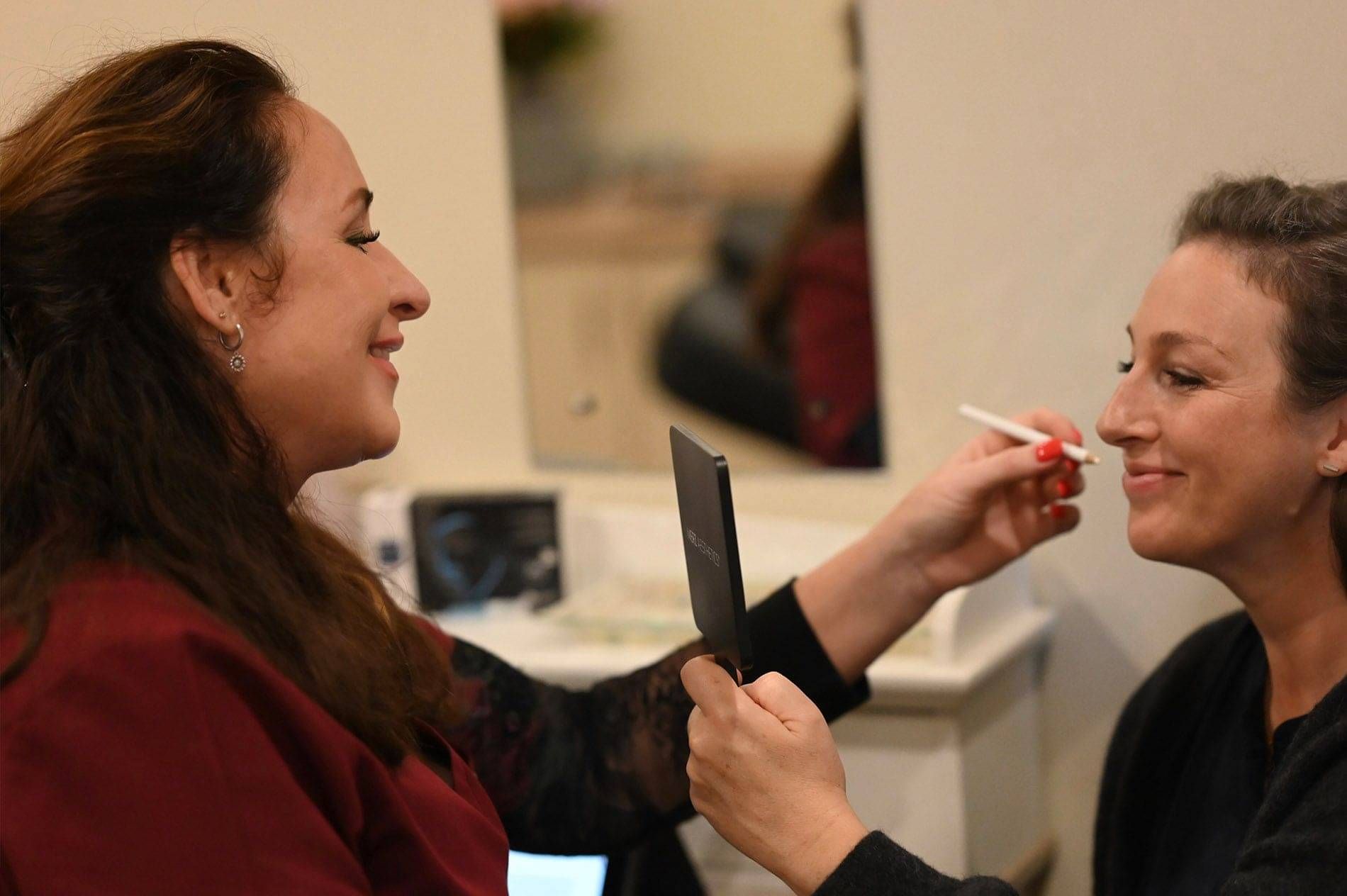 Photo of Kylie Dillon preparing a client for Cosmetic Treatment in Wellington