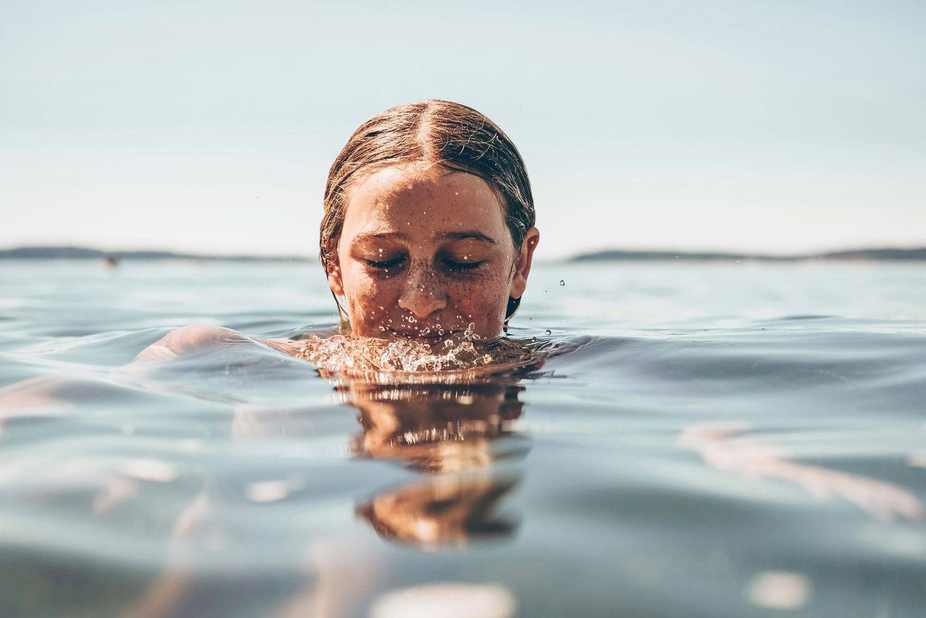 Photo of a woman happy in the sea