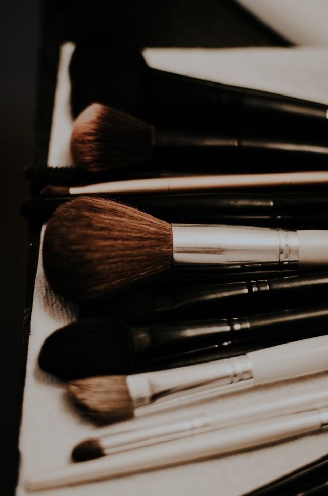 Makeup brushes stacked together.