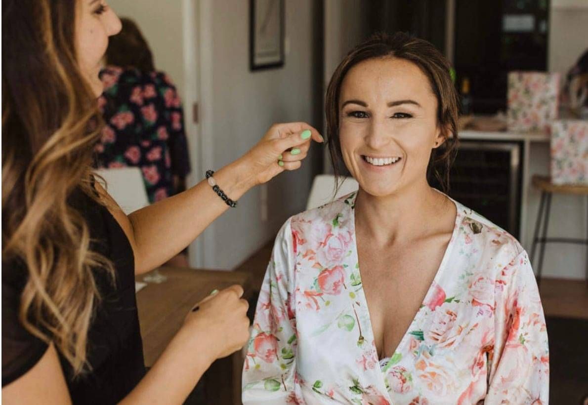 A happy bride having her hair and make up look created by Georgie.