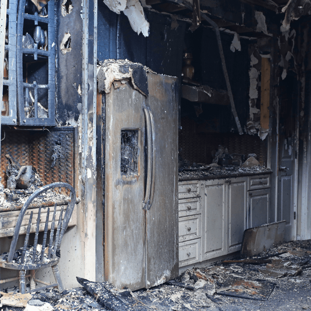 a kitchen with fire damage in a house in Rotorua
