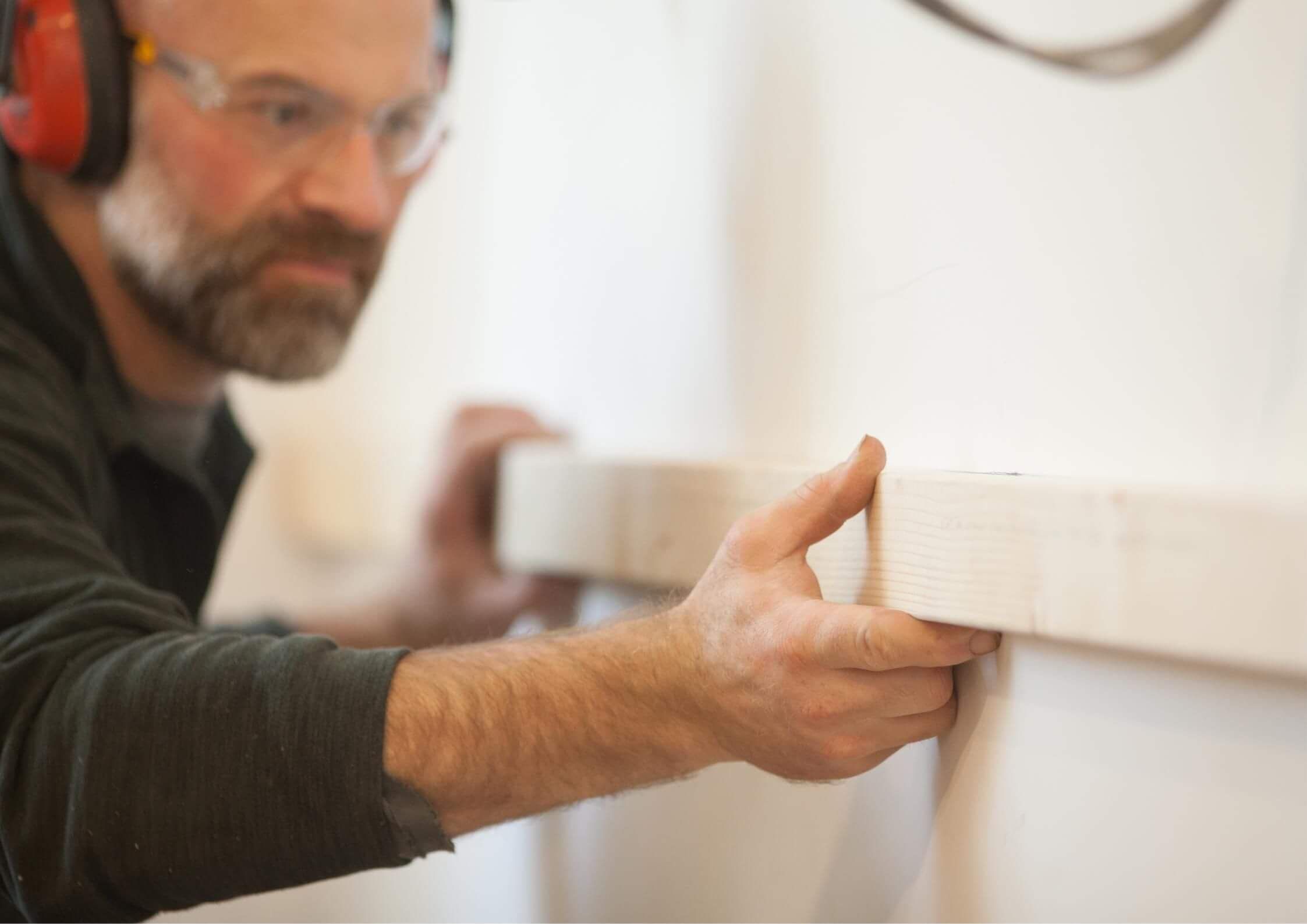 a builder using precision installing a beam in a house for insurance reinstatement in Rotorua