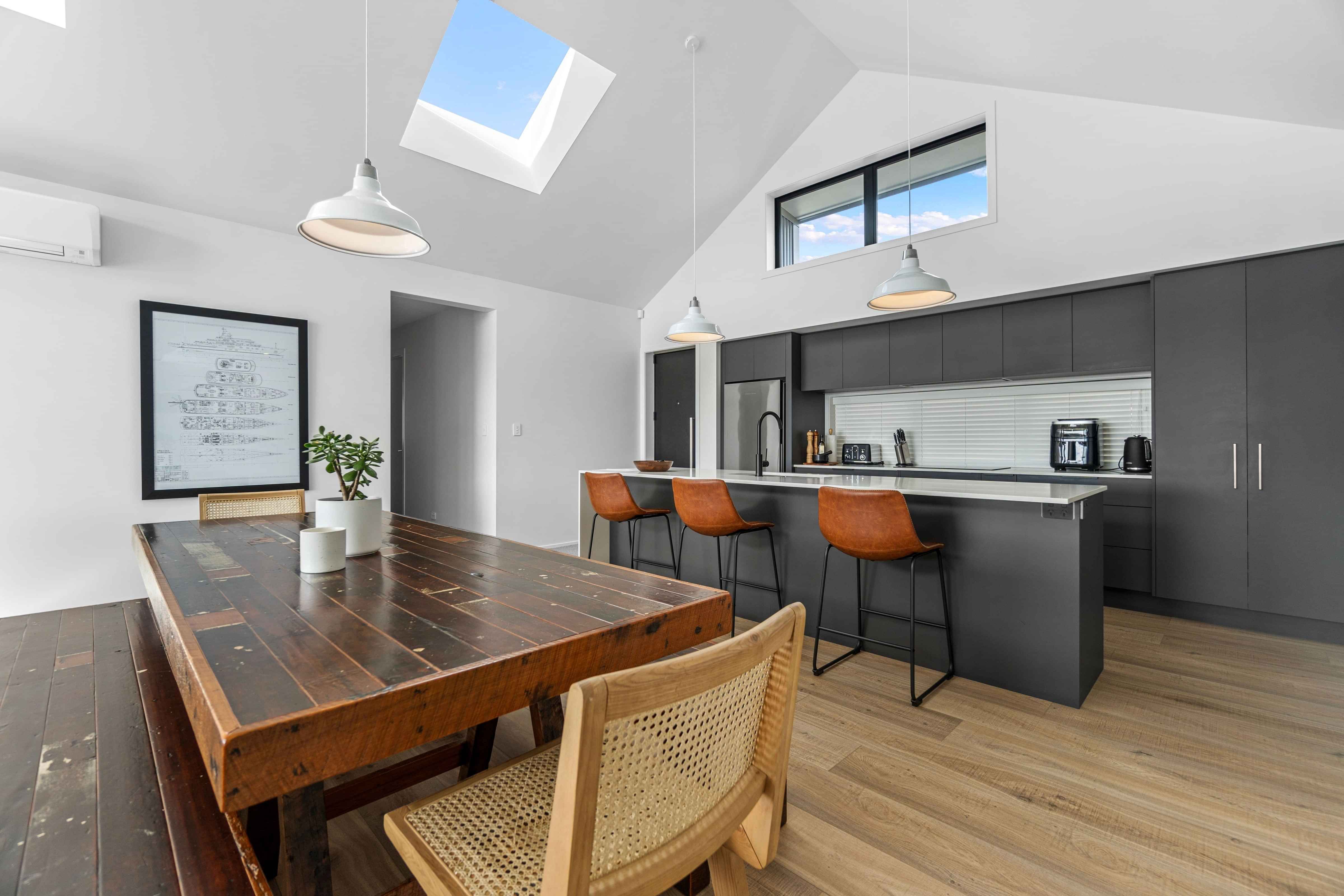 Open-plan kitchen and dining in Rangatahi award winning house