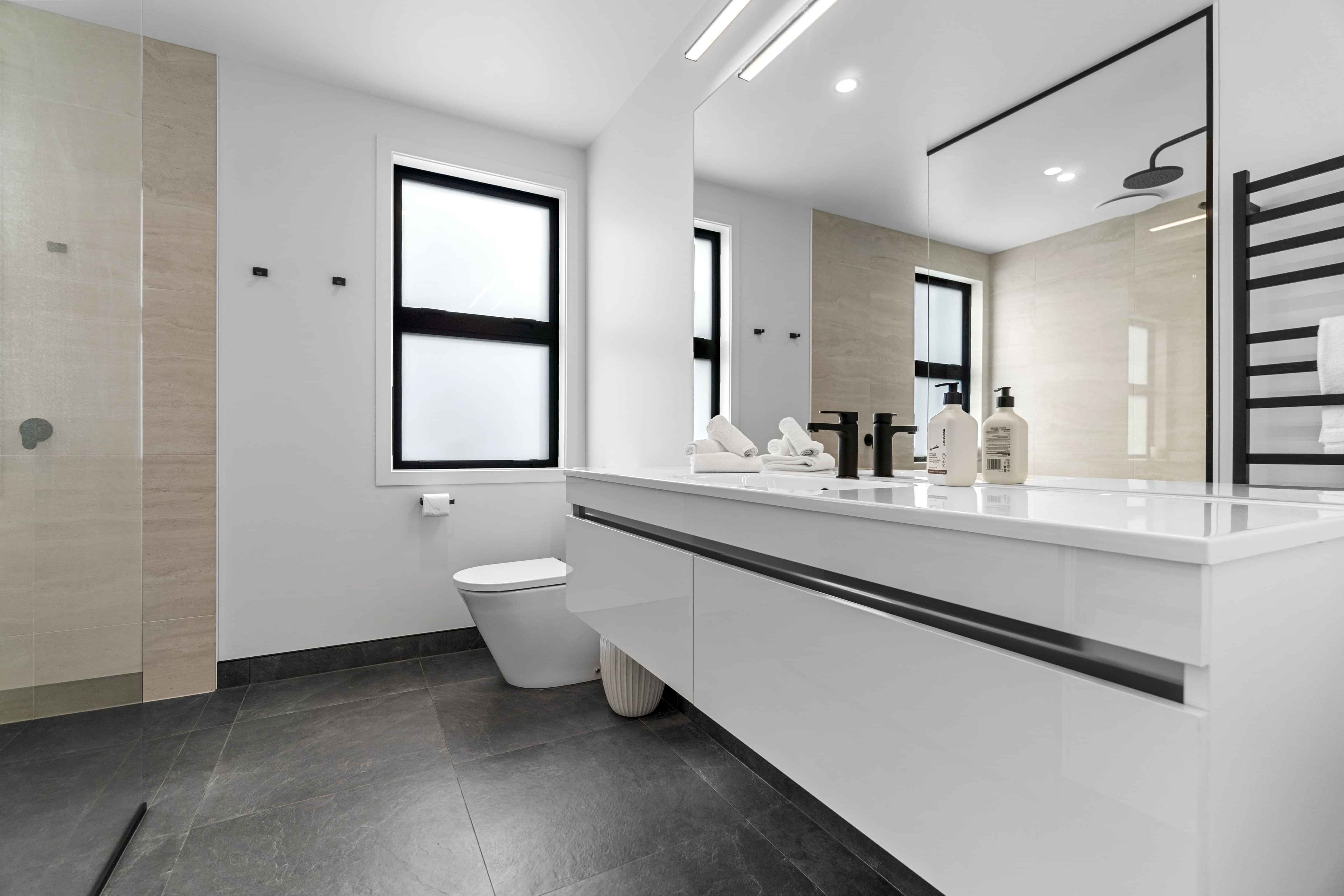 Durable bathroom finishes in Rangatahi award winning house by GV Homes