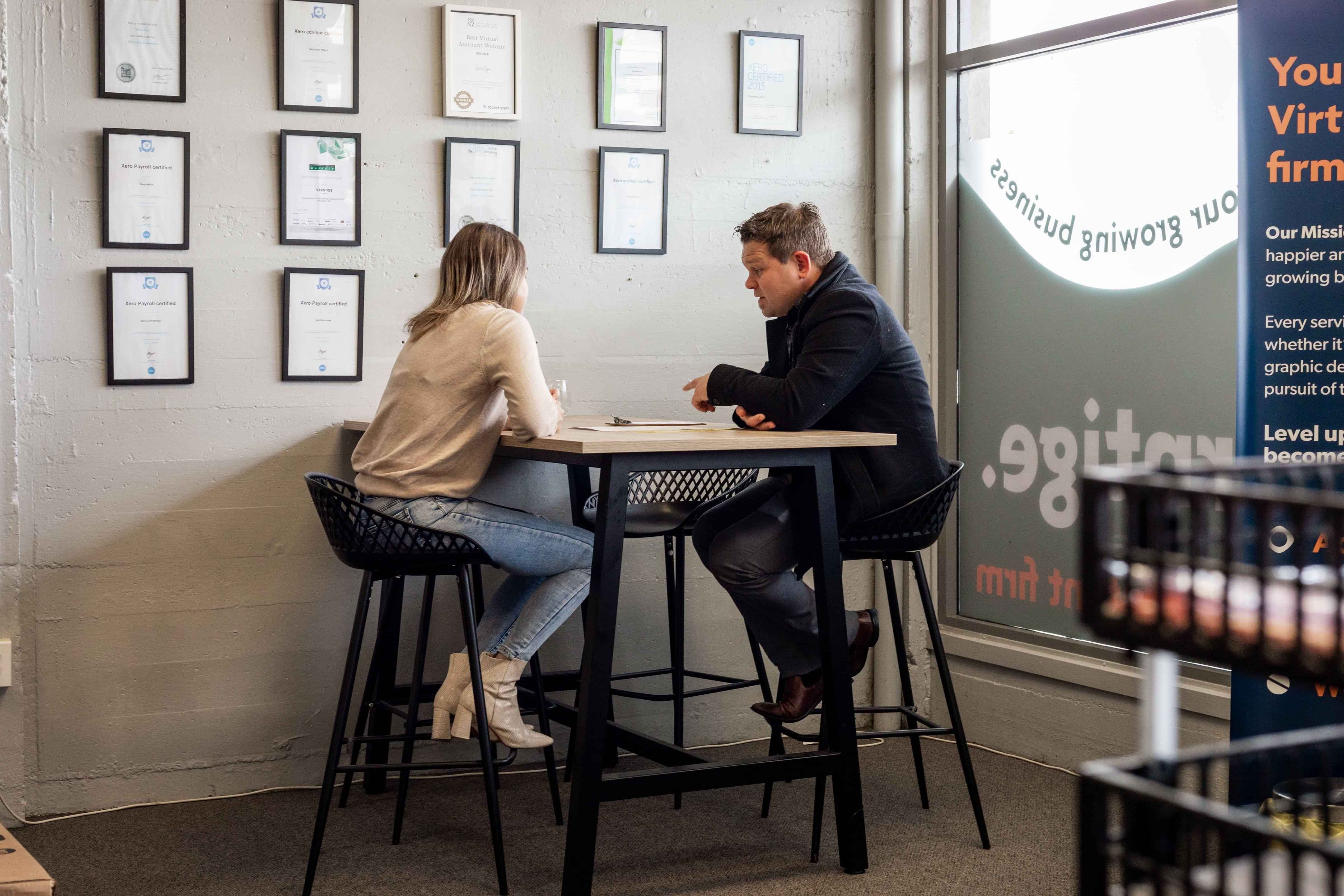 Business Owner and Insurance Adviser in a meeting