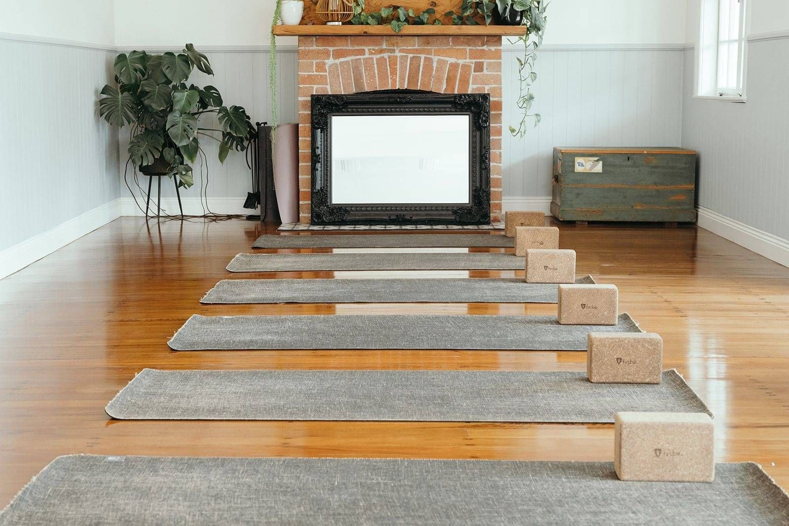 Yoga mats laid out with a block ready for a class