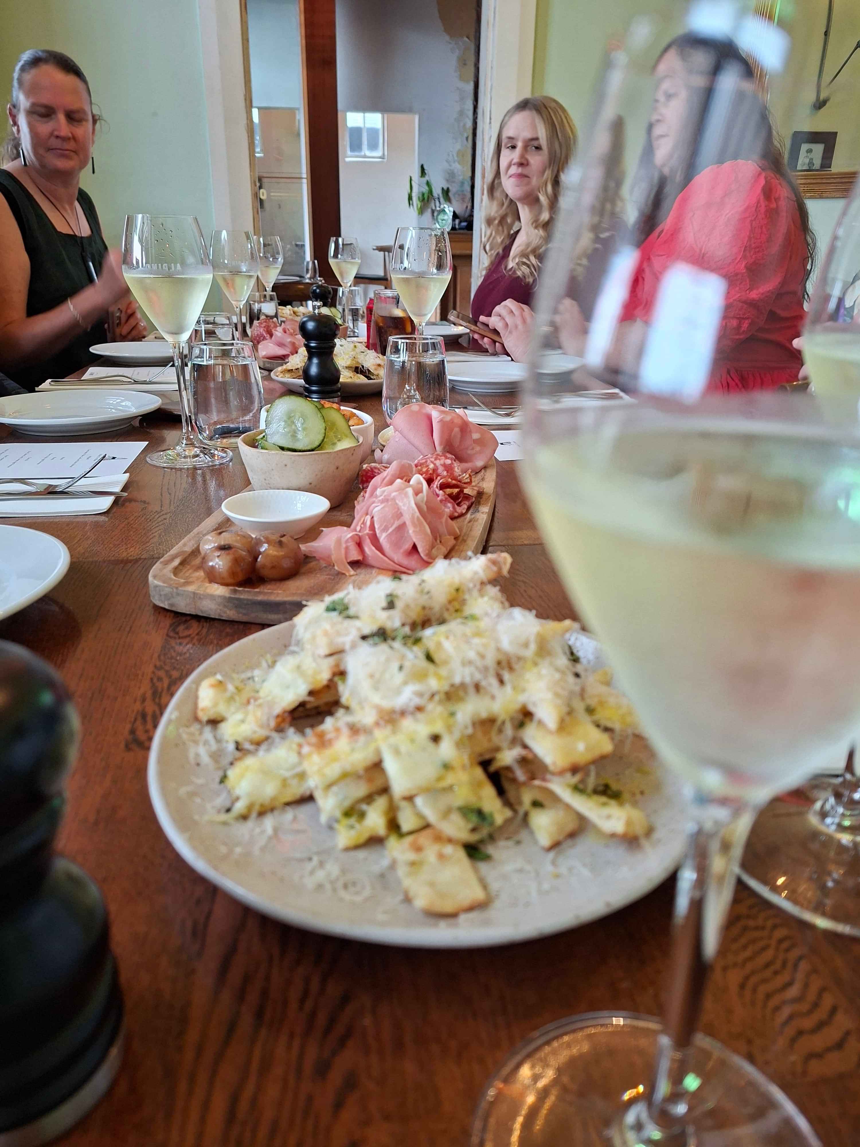 Outside of an early 1900s building housing a book shop, with a bicycle outside