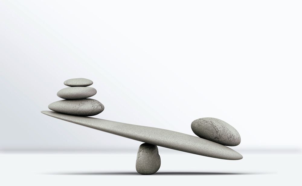 Balanced stones on a scale, symbolising legal support for estate and Will disputes