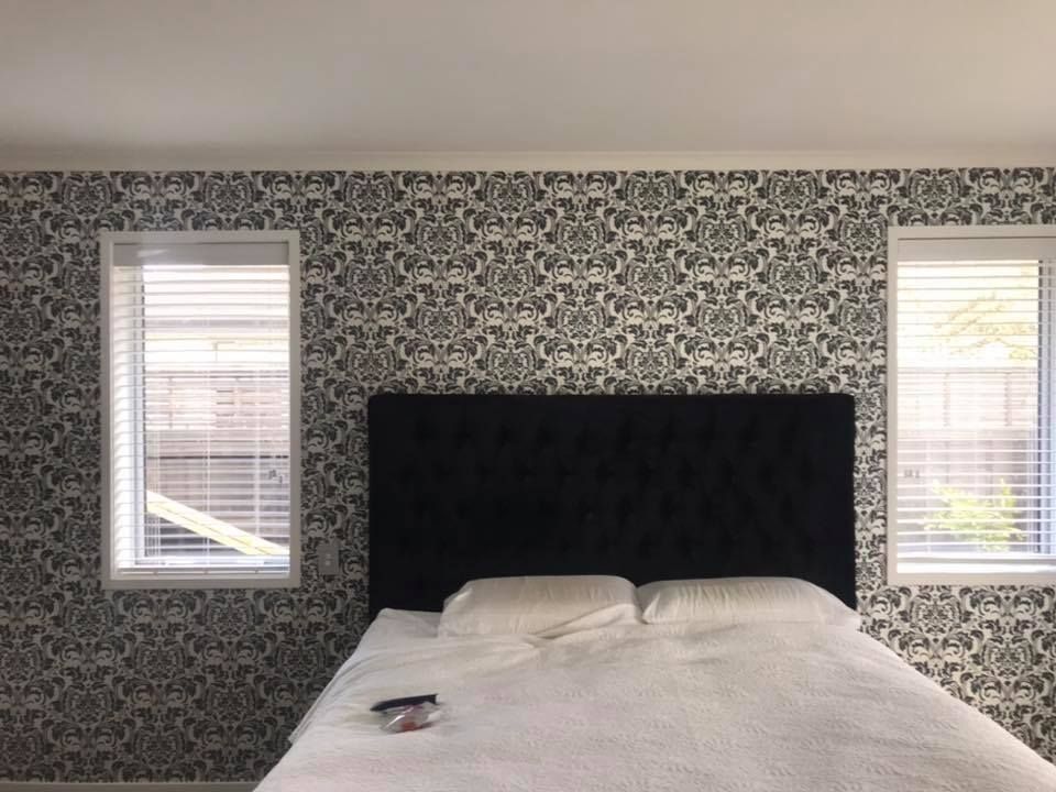 Wallpaper hanging completed in bedroom