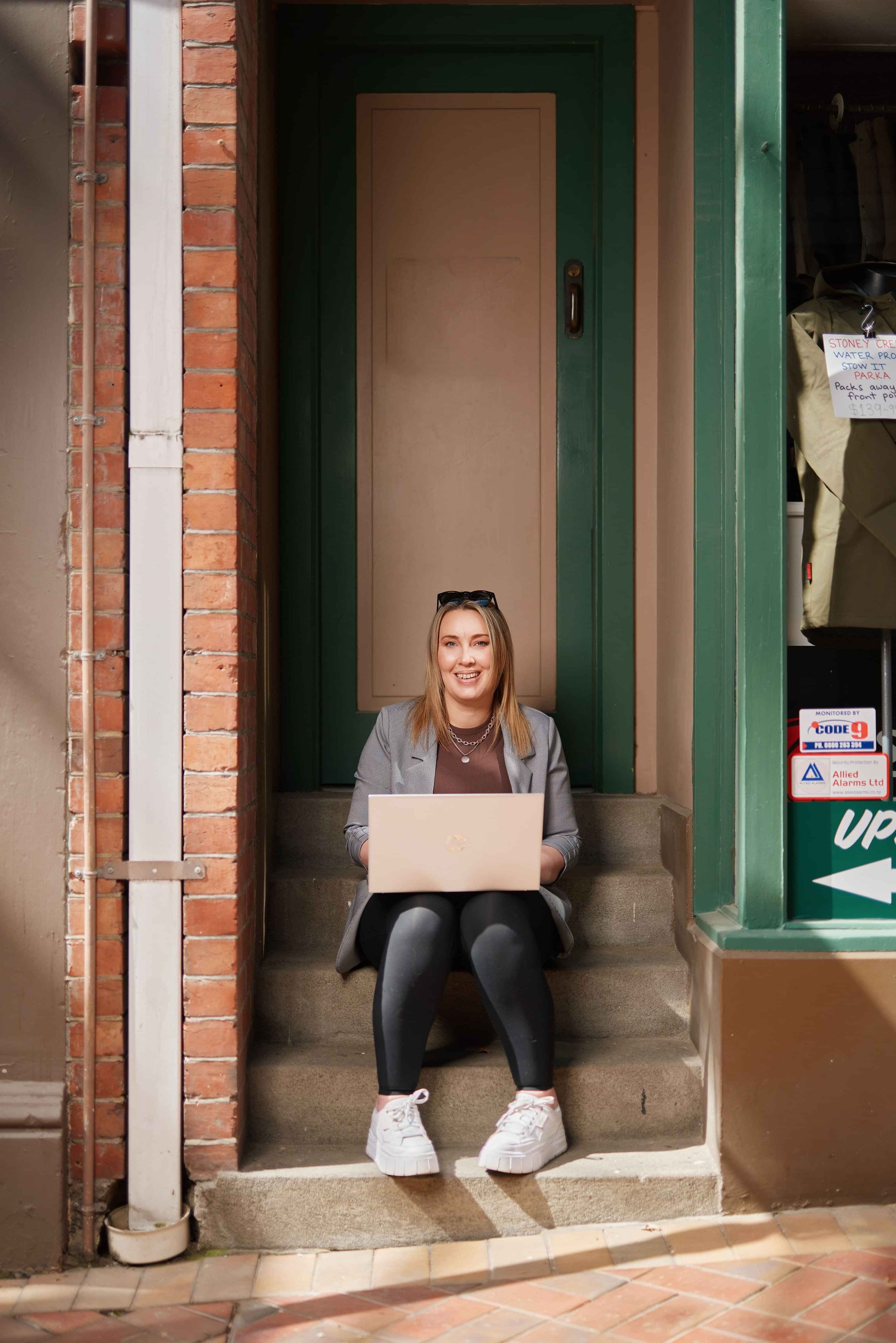 Picture of Amber with laptop sitting on steps