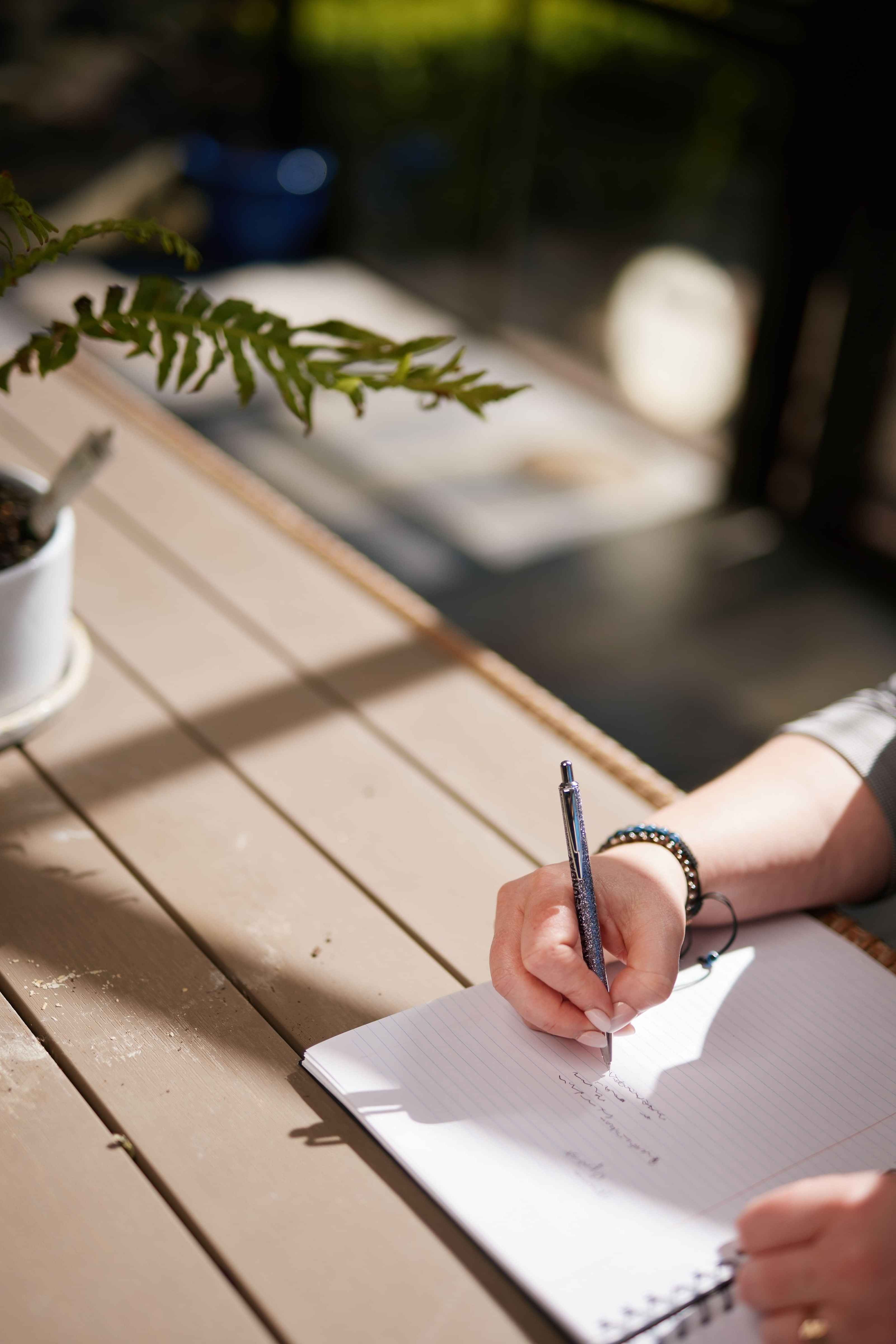 Picture of Amber writing in a notebook