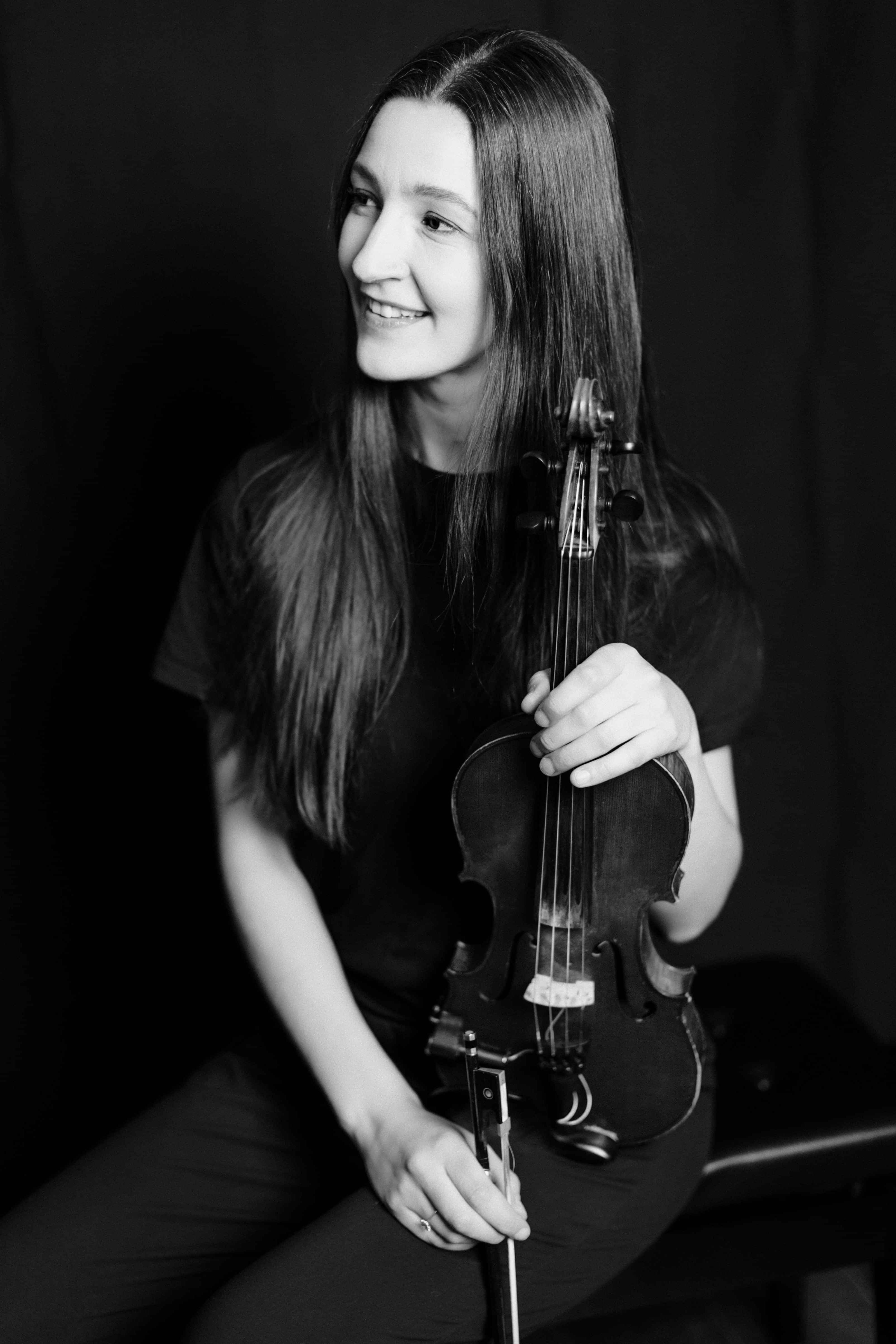 Erica playing the violin out at an event in Queenstown.