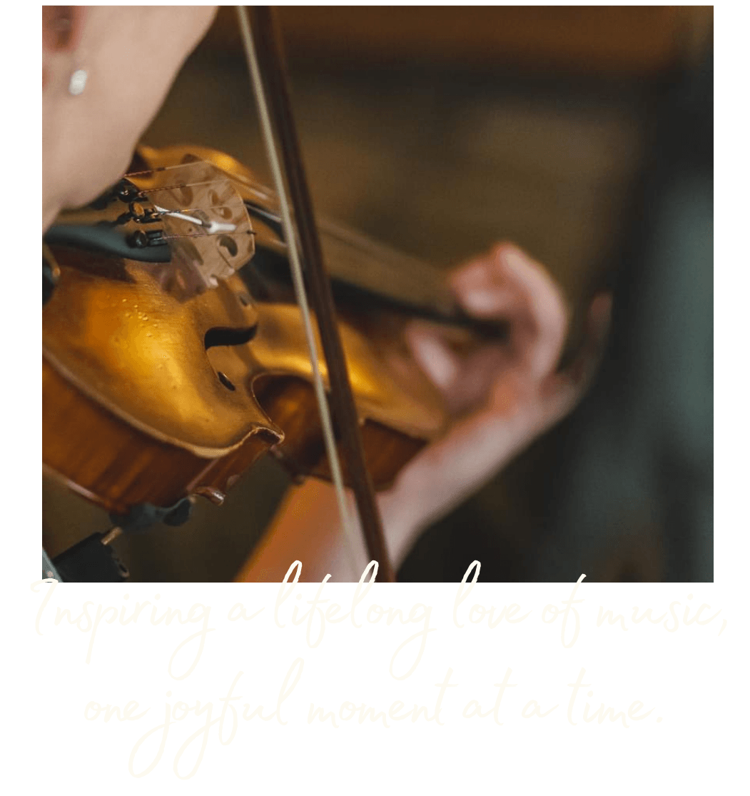 A close up of Erica playing her violin. With 'Inspiringa lifelong love of music, one joyful moment at a time.'