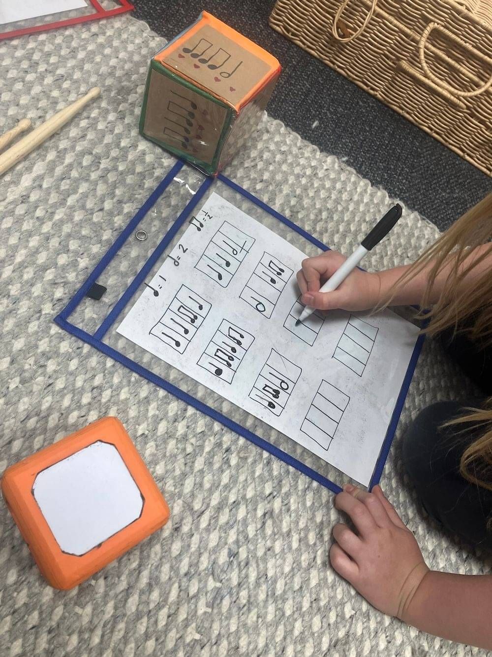 A student filling out a theory worksheet.