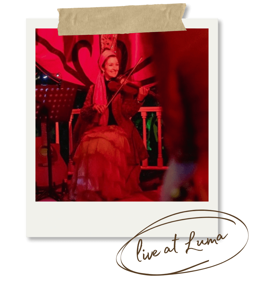 Erica playing violin live at the LUMA Queenstown event.